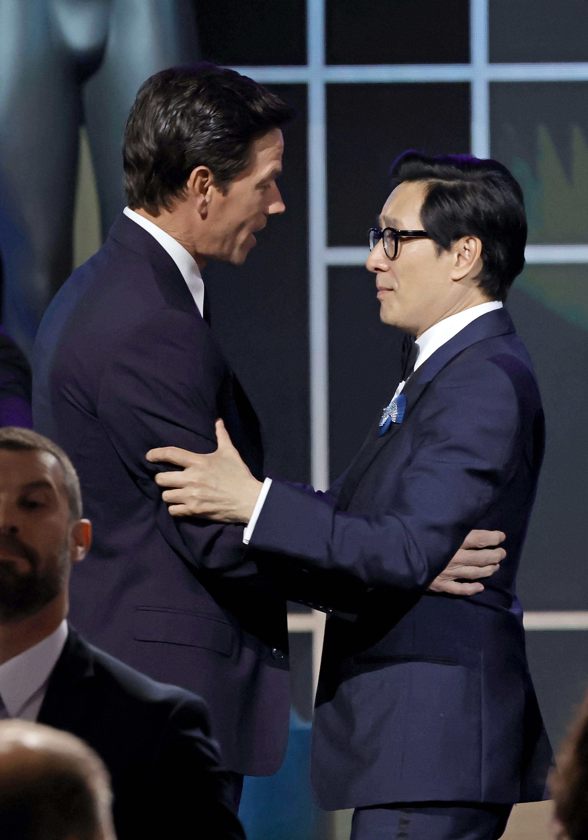 LOS ANGELES, CALIFORNIA - FEBRUARY 26: (L-R) Mark Wahlberg presents Ke Huy Quan with the Outstanding Performance by a Cast in a Motion Picture award for "Everything Everywhere All at Once" onstage during the 29th Annual Screen Actors Guild Awards at Fairmont Century Plaza on February 26, 2023 in Los Angeles, California. (Photo by Kevin Winter/Getty Images)