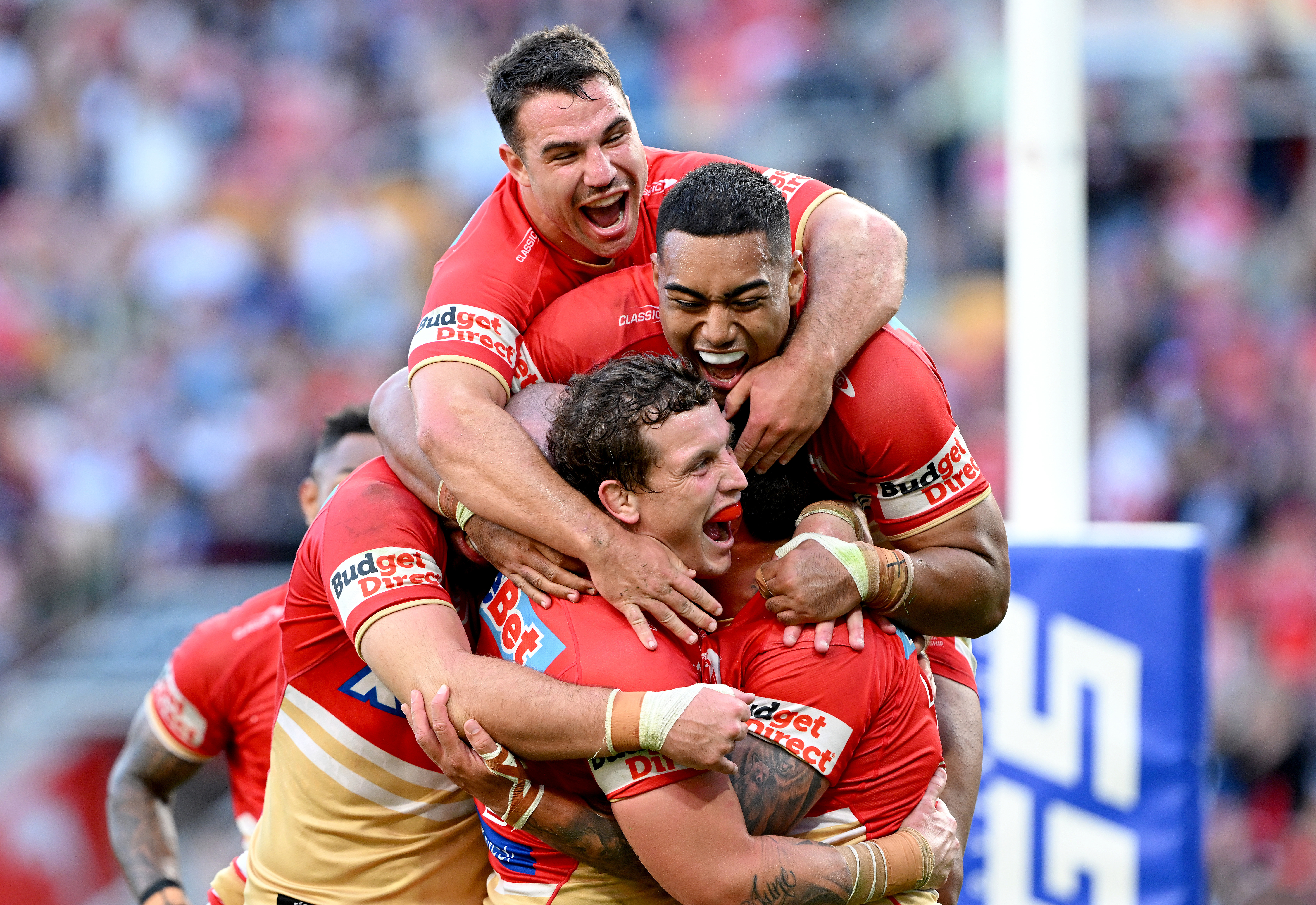 Kenny Bromwich of the Dolphins is congratulated by team mates after scoring a try during the round 27 NRL match between the Dolphins and New Zealand Warriors at Suncorp Stadium on September 02, 2023 in Brisbane, Australia. (Photo by Bradley Kanaris/Getty Images)