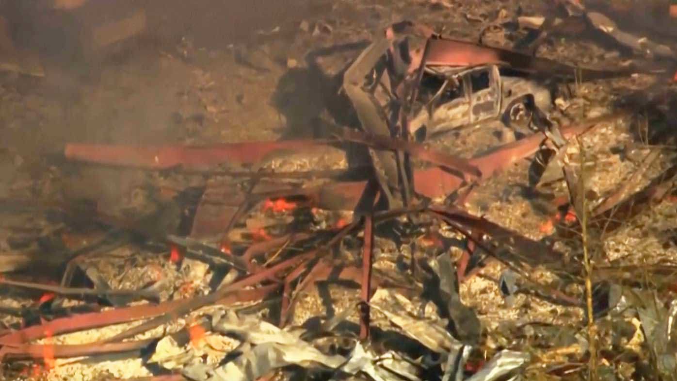 Debris covers the ground and vehicles after a powerful blast ripped through a military explosives manufacturing plant in Hickman County, Tennessee.