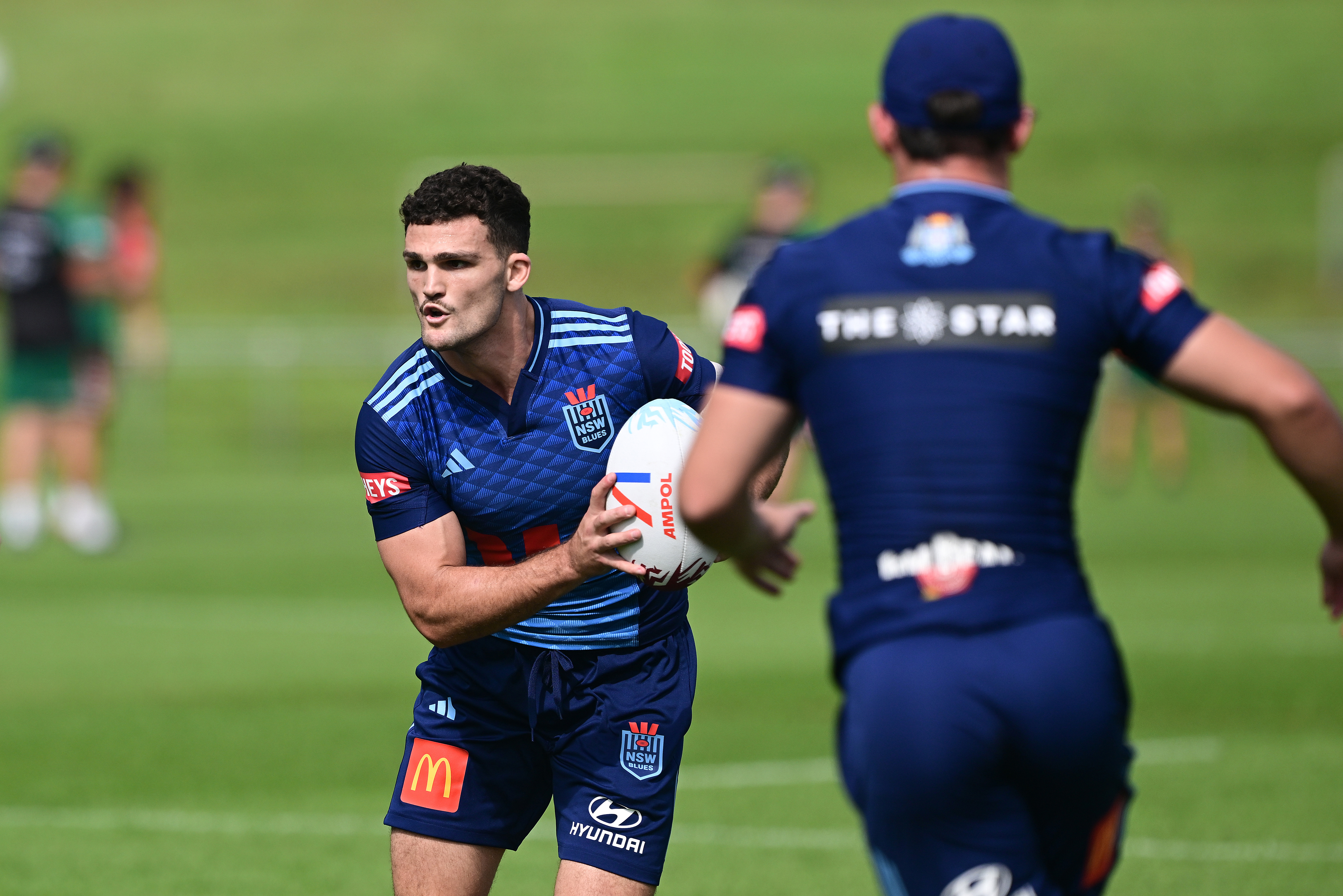 Nathan Cleary looks to pass during Blues training.