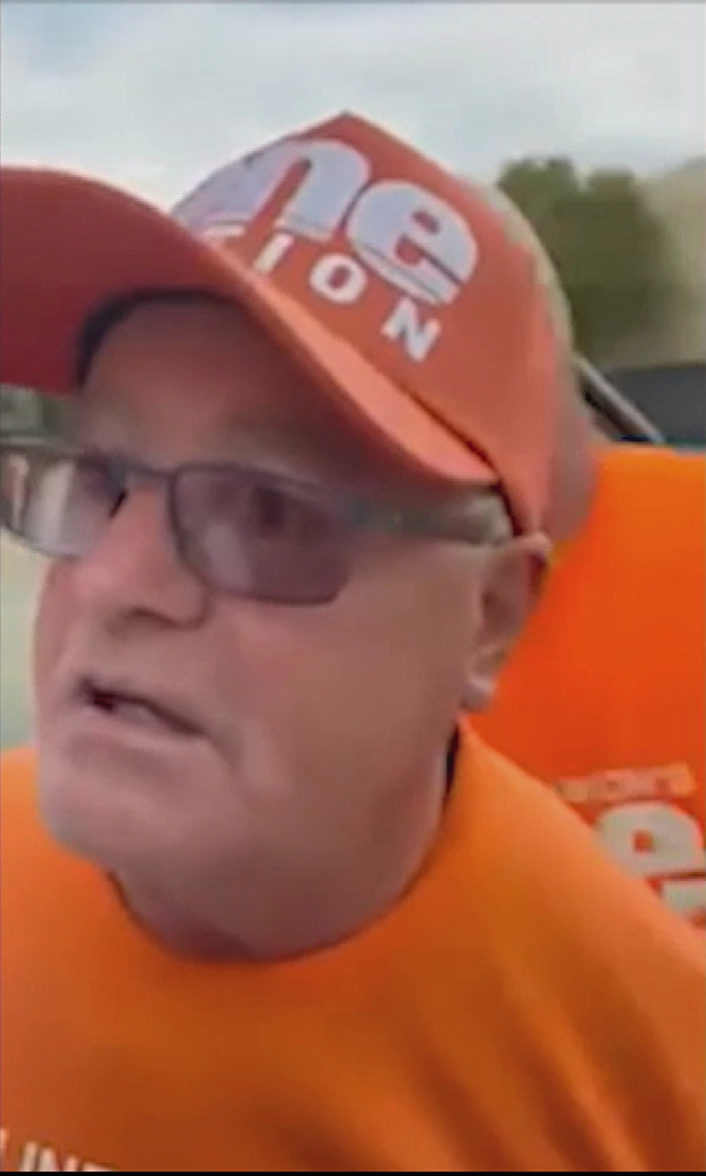 The One Nation volunteer attempted to grab James Paterson's phone after realising their conversation was being filmed.