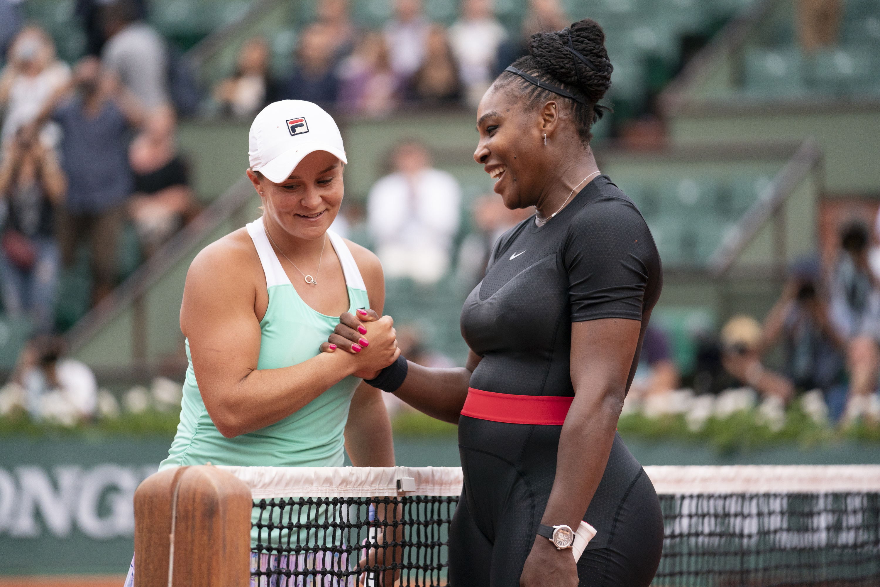 Serena Williams of The United States is congratulated on victory by Ashleigh Barty of Ausralia following their singles match during the 2018 French Open.