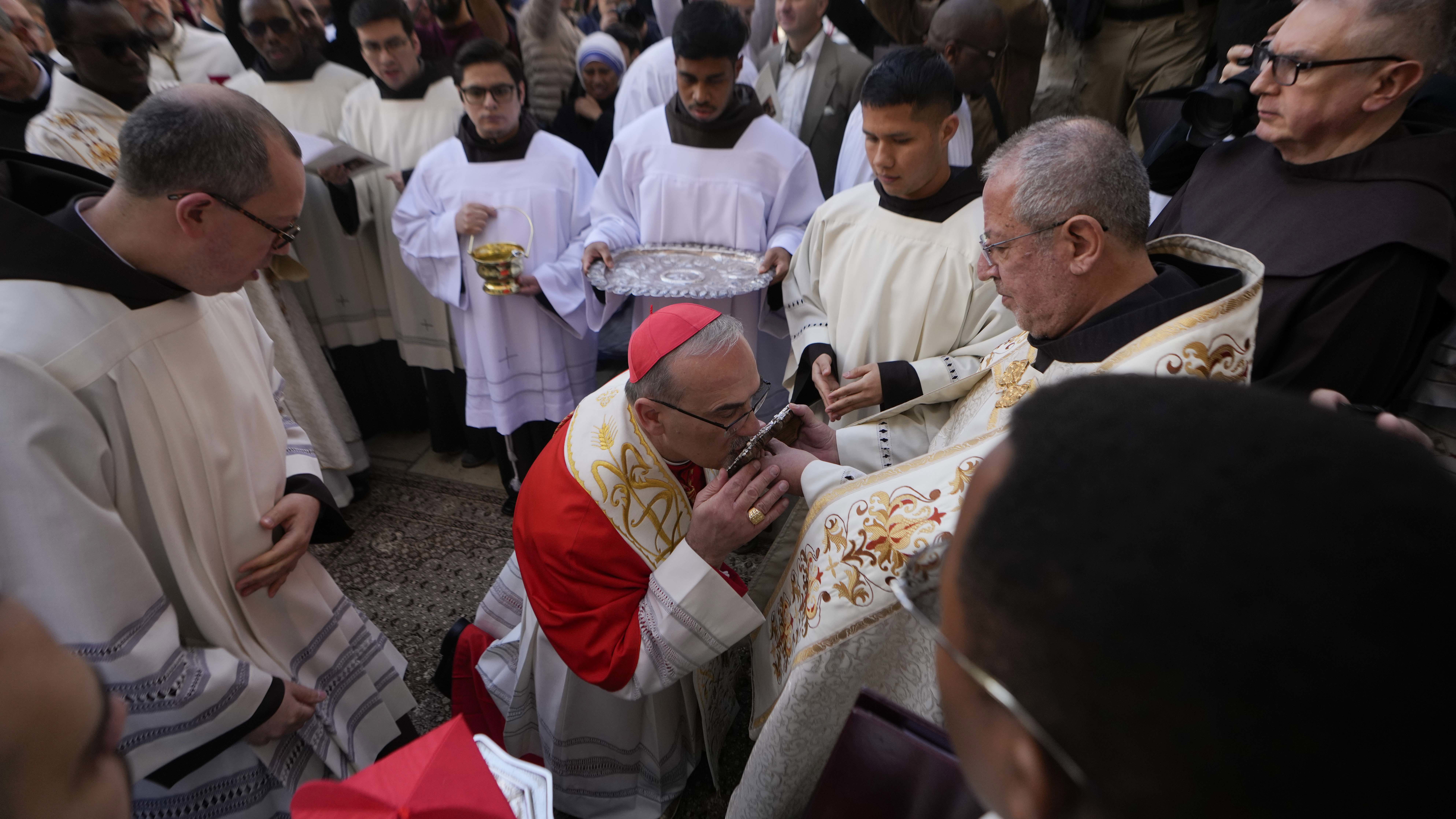 Latin Patriarch Pierbattista Pizzaballa, the top Catholic clergyman in the Holy Land, center, arrives at the Church of the Nativity, traditionally believed to be the birthplace of Jesus, on Christmas Eve in the West Bank city of Bethlehem, Tuesday, Dec. 24, 2024. (AP Photo/Matias Delacroix)