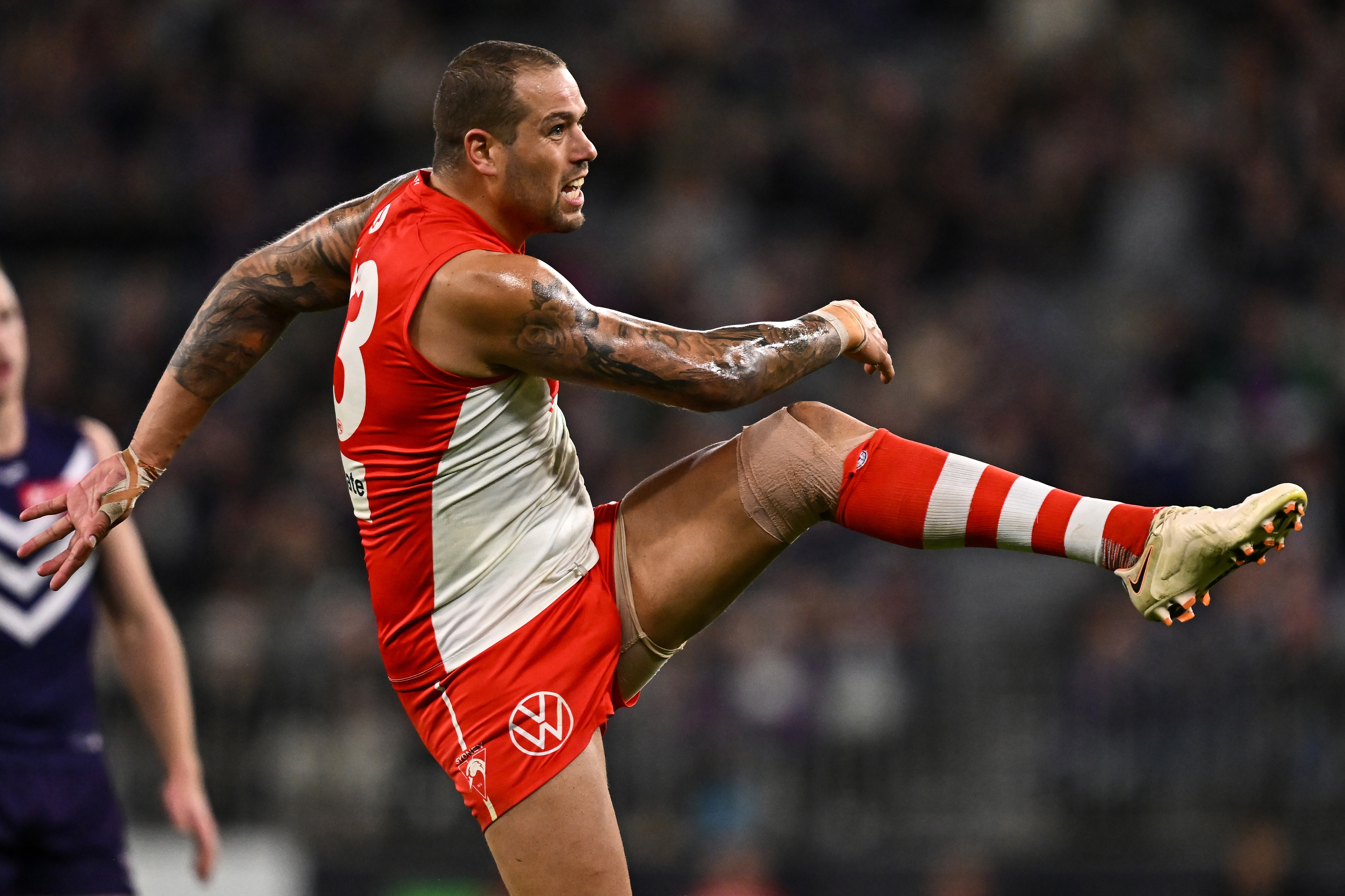 PERTH, AUSTRALIA - JULY 22: Lance Franklin of the Swans kicks a goal during the 2023 AFL Round 19 match between the Fremantle Dockers and the Sydney Swans at Optus Stadium on July 22, 2023 in Perth, Australia. (Photo by Daniel Carson/AFL Photos via Getty Images)