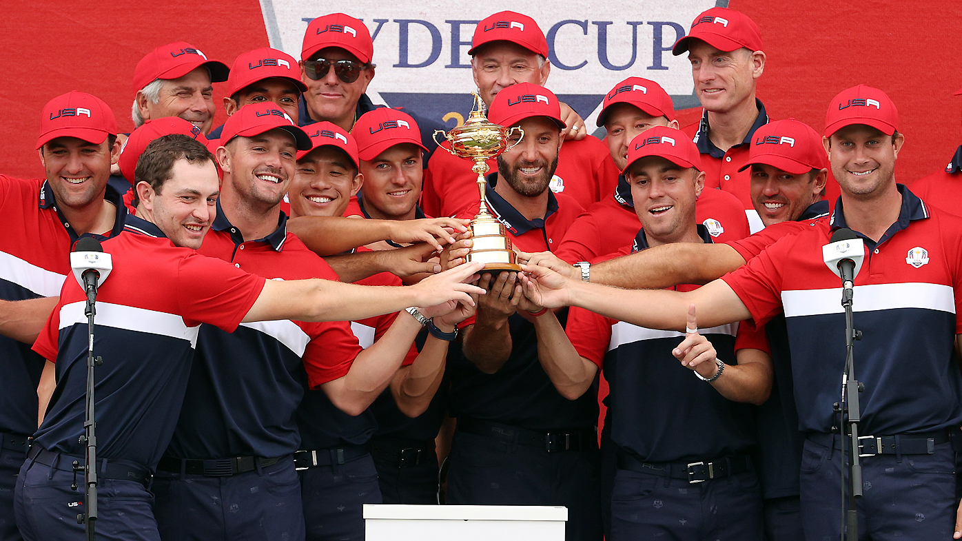 Team United States celebrates with the Ryder Cup after defeating Team Europe 19 to 9 