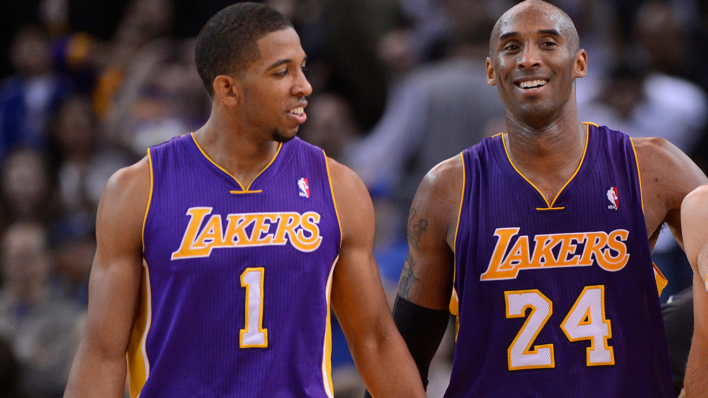 Los Angeles Lakers' Darius Morris (1), Kobe Bryant (24) celebrate their win agains the Golden State Warriors at Oracle Arena in Oakland, Calif. on Saturday, Dec. 22, 2012. Los Angeles defeated Golden State 118-115 in overtime. (Jose Carlos Fajardo/Staff)