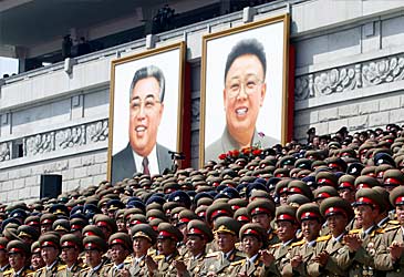 Portraits of Kim Il-sung and Kim Jong-il at parade (Getty)