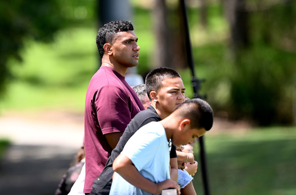 Tevita Pangai Junior watches a Broncos training session at Red Hill.