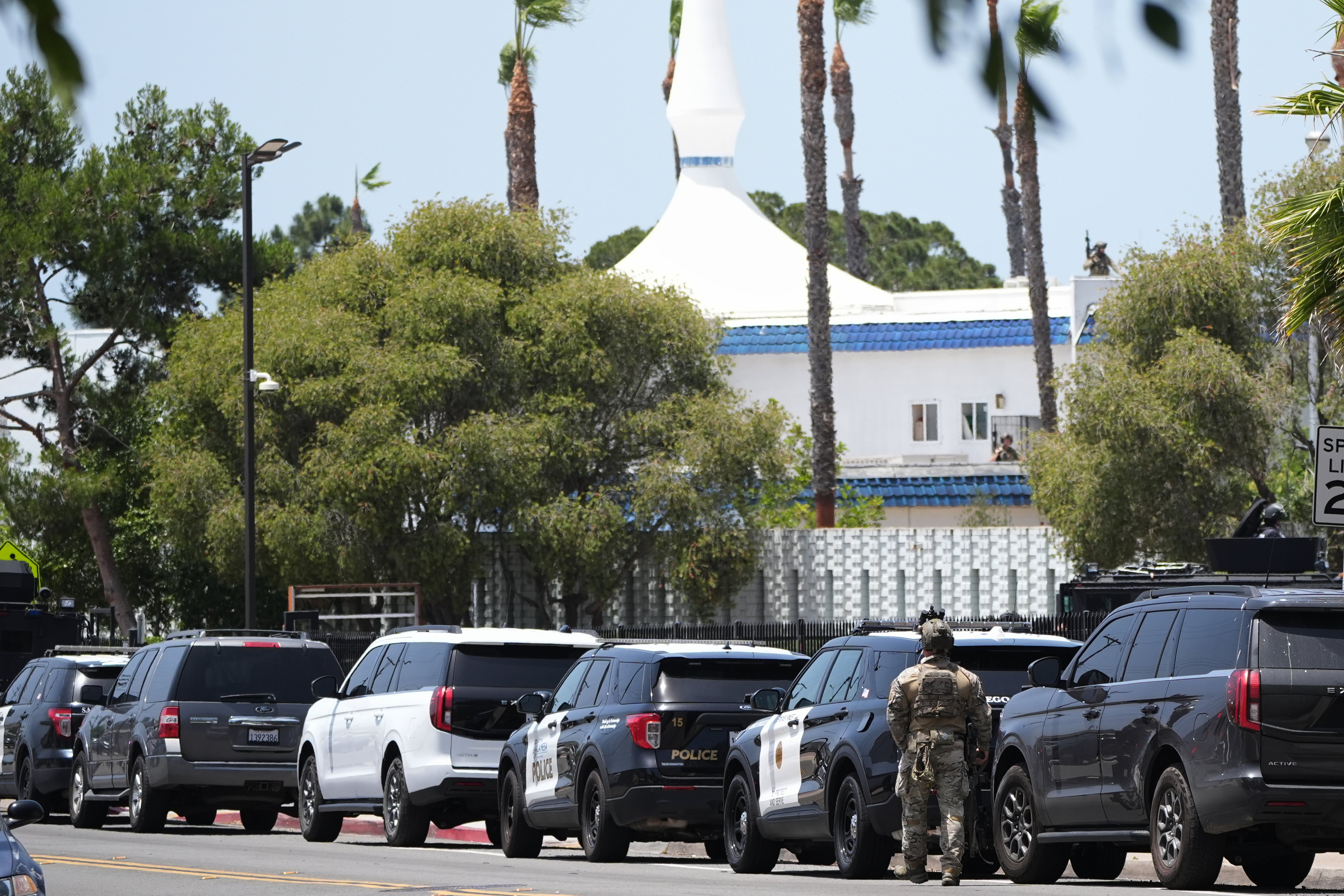 Police stage at the scene of a shooting outside the Islamic Center of San Diego Monday, May 18, 2026, in San Diego.