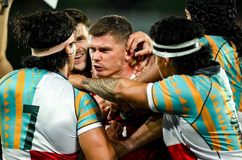 Owen Farrell of British & Irish Lions gets involved with Charlie Gamble of First Nations & Pasifika XV.