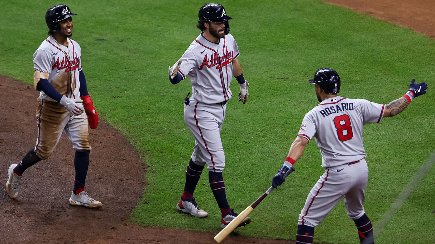  Dansby Swanson #7 celebrates with Eddie Rosario #8 of the Atlanta Braves after hitting a two-run home run in the fifth inning during Game 6