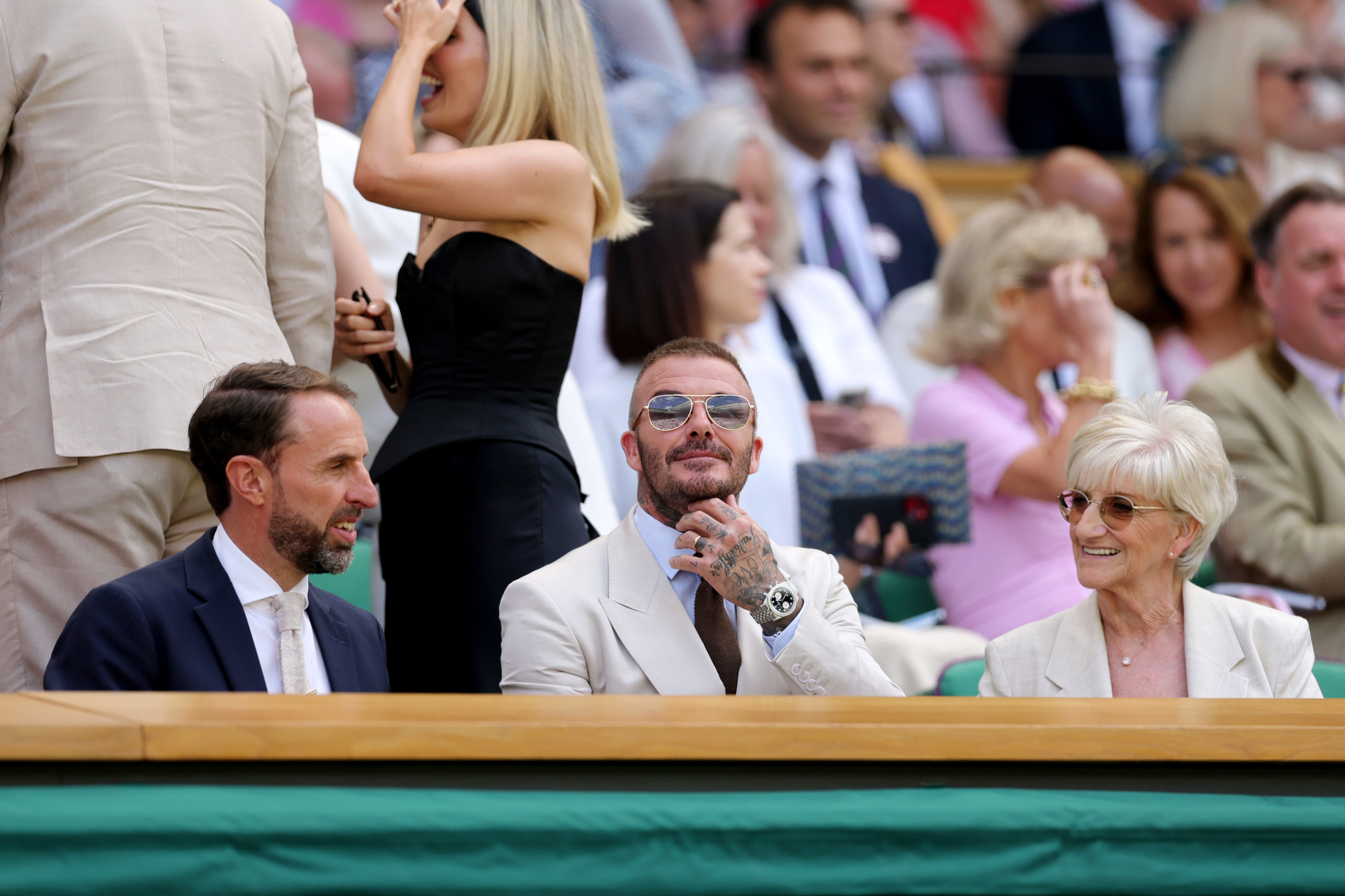 LONDON, ENGLAND - JUNE 30: Sir Gareth Southgate, Sir David Beckham and Sandra Beckham are seen in the Royal Box prior to the Gentlemen's Singles first round match between Fabio Fognini of Italy and Carlos Alcaraz of Spain on day one of The Championships Wimbledon 2025 at All England Lawn Tennis and Croquet Club on June 30, 2025 in London, England. (Photo by Julian Finney/Getty Images)