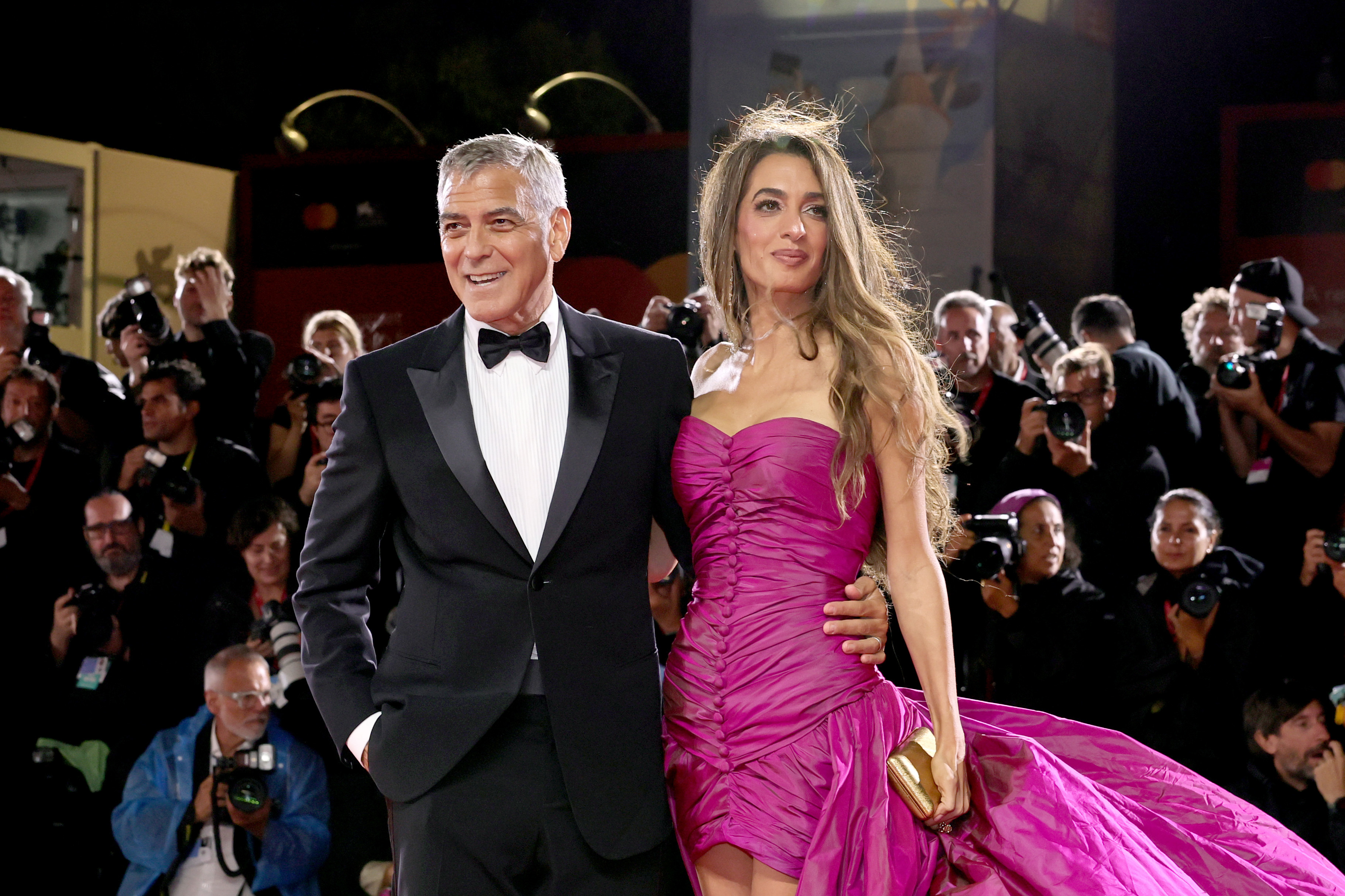 VENICE, ITALY - AUGUST 28: George Clooney and Amal Clooney attend the "Jay Kelly" red carpet during the 82nd Venice International Film Festival on August 28, 2025 in Venice, Italy. (Photo by Theo Wargo/Getty Images)