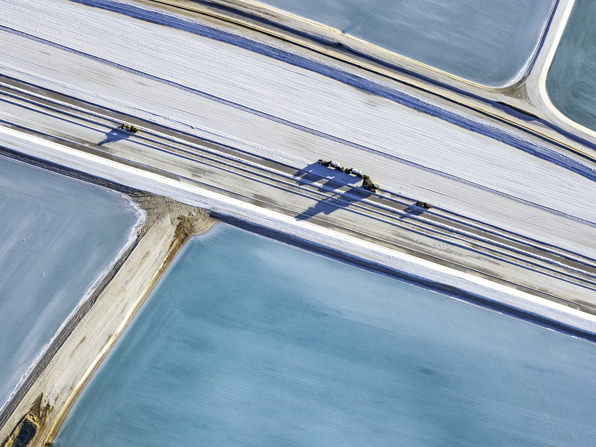 Aerial photo taken from a small plane showing a salt works and machinery at Useless Loop, Shark Bay, Western Australia
