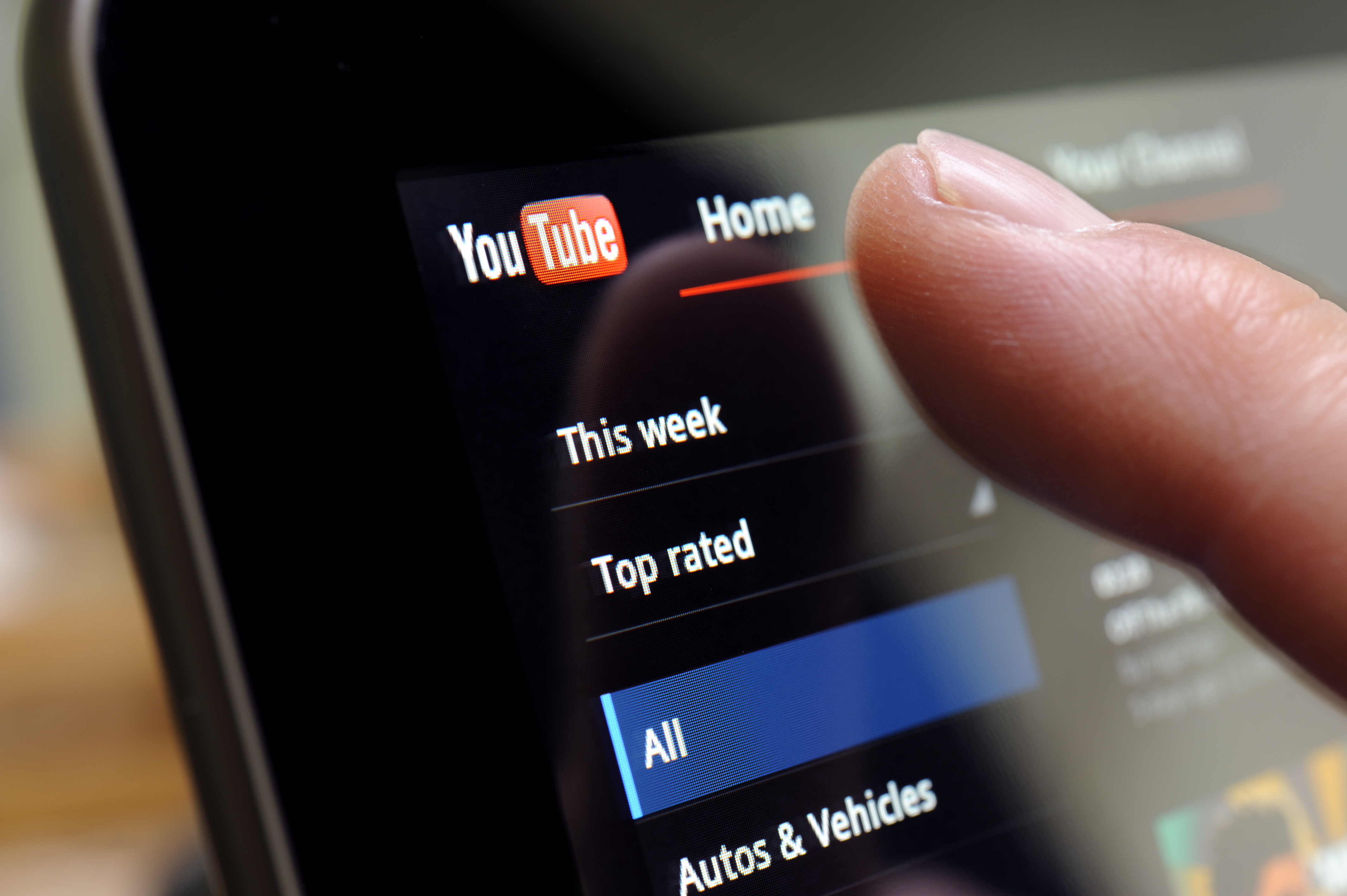 You Tube Site on Tablet PC Screen with finger ready to touch .