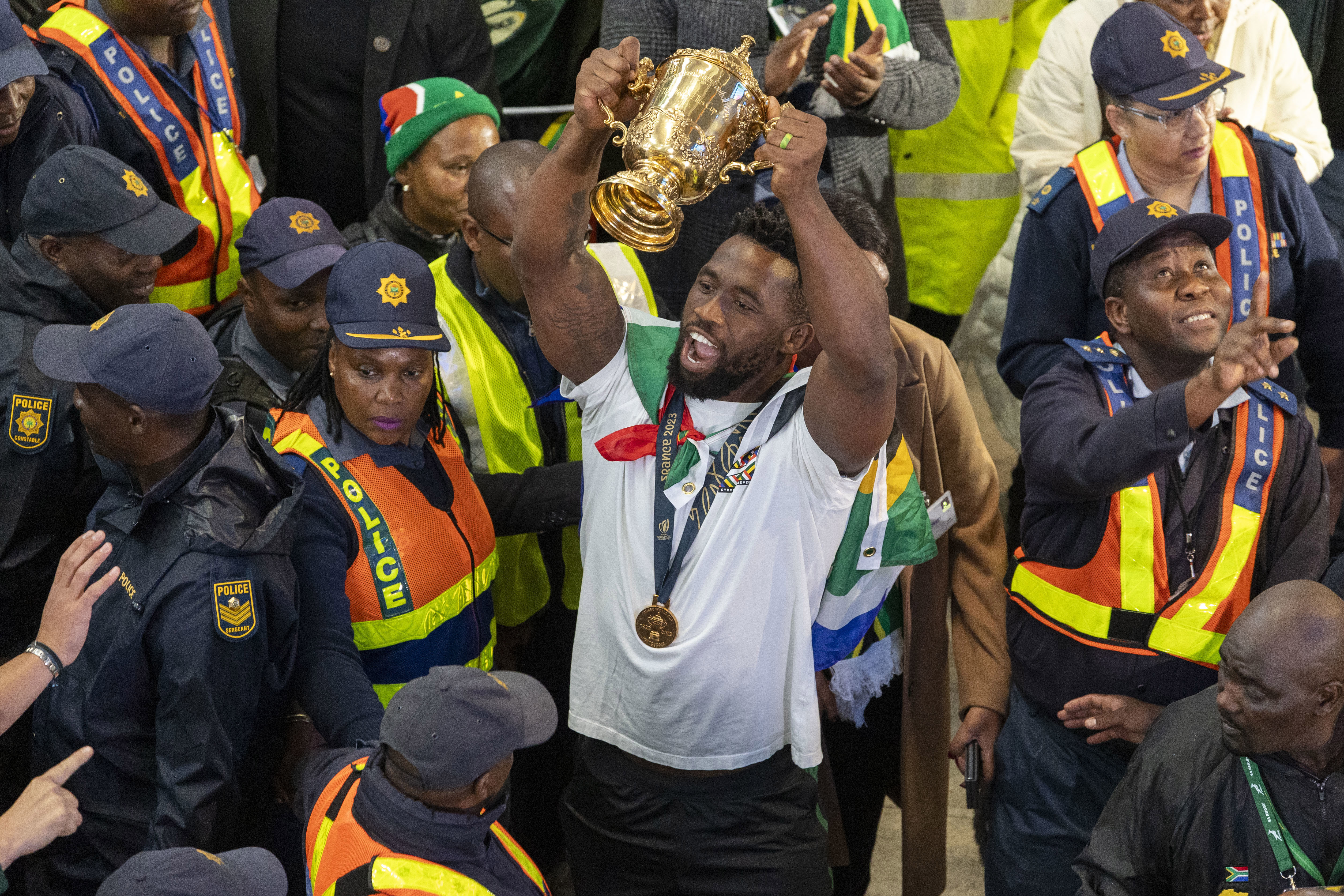 Springboks caption Siya Kolisi lifts the Webb Ellis Cup at OR Tambo International Airport.