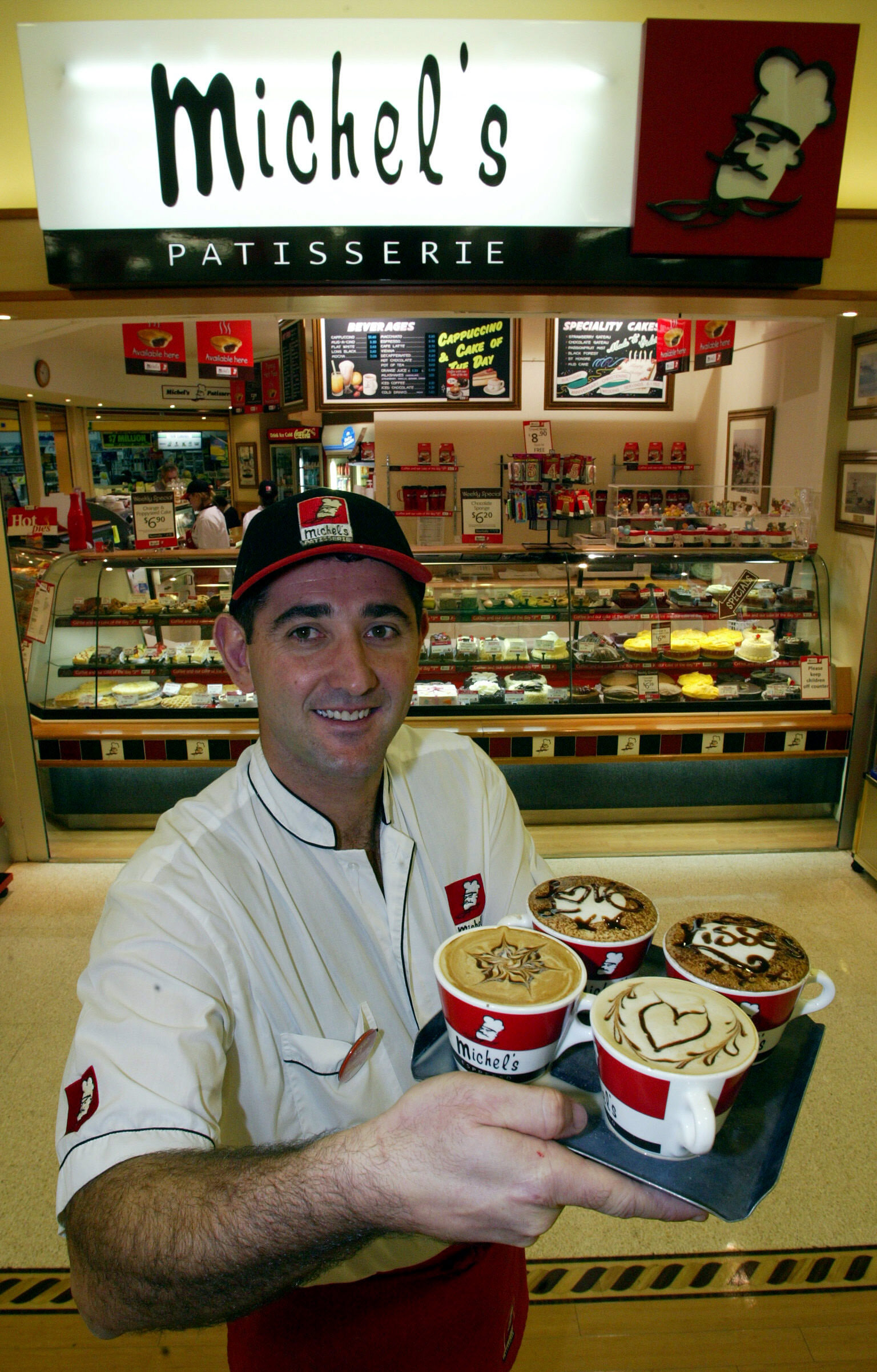 Mercury Business-Michels Kiama Michel s Patisserie franchise owner Joe Biscotto with some coffes which have helped to the 40% increase in profits for the store largely part to better quality. Friday 23 May 2003 PICTURE ANDY ZAKELI-Story Greg Ellis SPECIALX 00032724