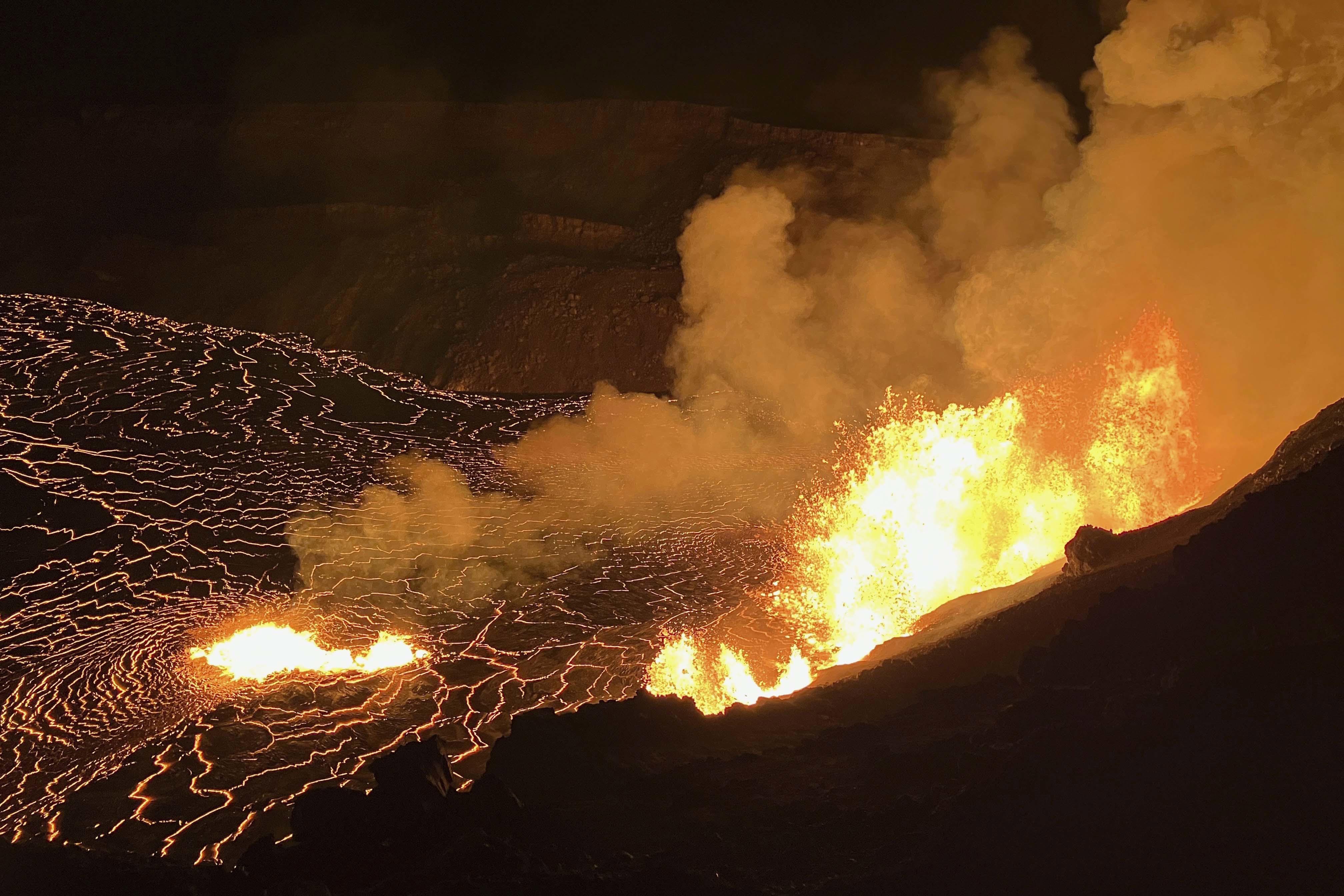 In this photo provided by the U.S. Geological Survey, an eruption takes place on the summit of the Kilauea volcano in Hawaii, Monday, Dec. 23, 2024. (N. Deligne/U.S. Geological Survey via AP)