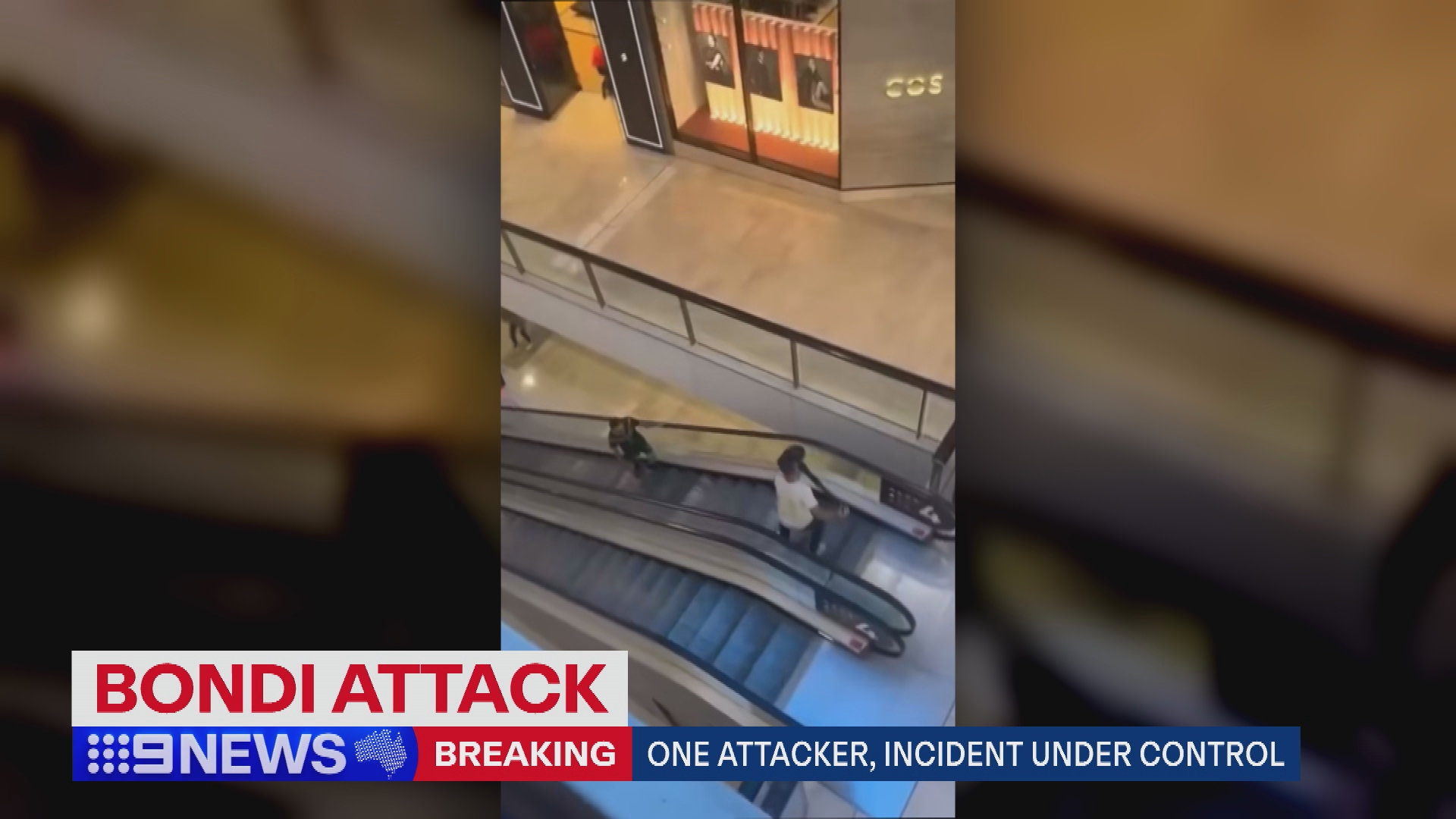 V﻿ideo has emerged of a shopper confronting a man, who was armed with a knife, with a bollard on an escalator at a bondi junction westfield