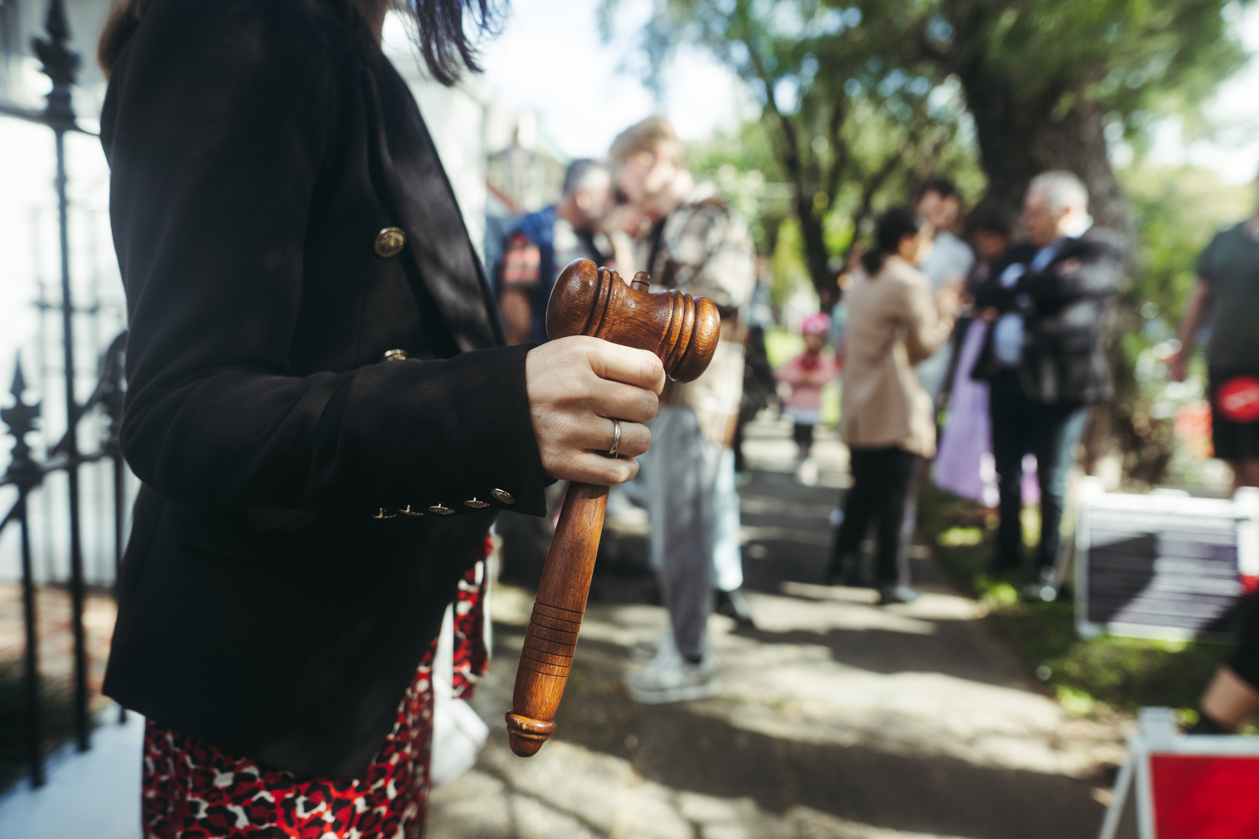 GENERIC Real estate, gavel, Auction sign, auction crowd, auction action, housing, selling housing, People arrive at an R&W house auction on 131 Corunna Road Stanmore, Saturday 13th of May 2023. Photo: Dion Georgopoulos / The Sydney Morning Herald