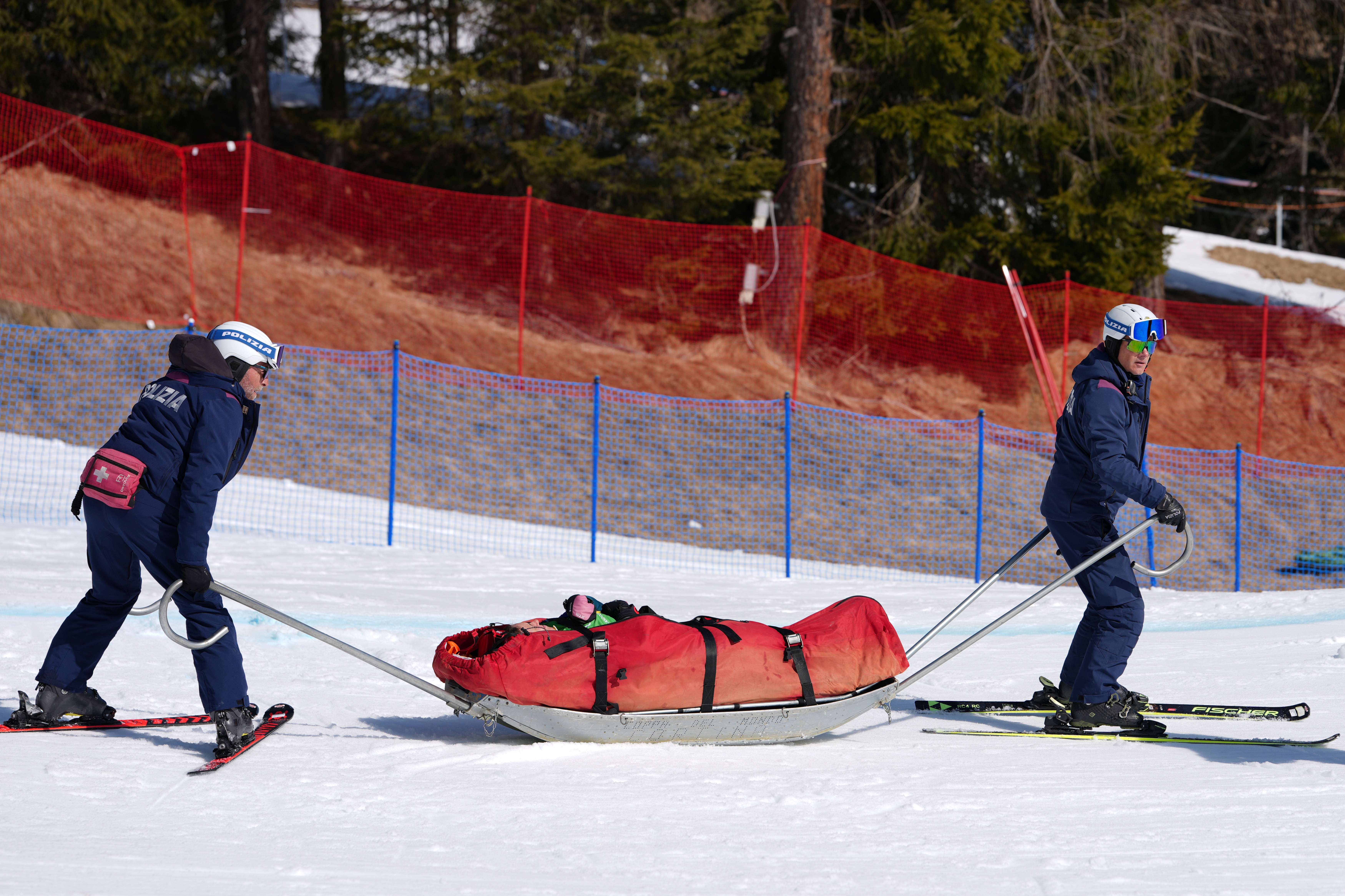 Amanda Reid of Australia is evacuated after crashing during a women's snowboard cross SB-LL2 pre-heat.