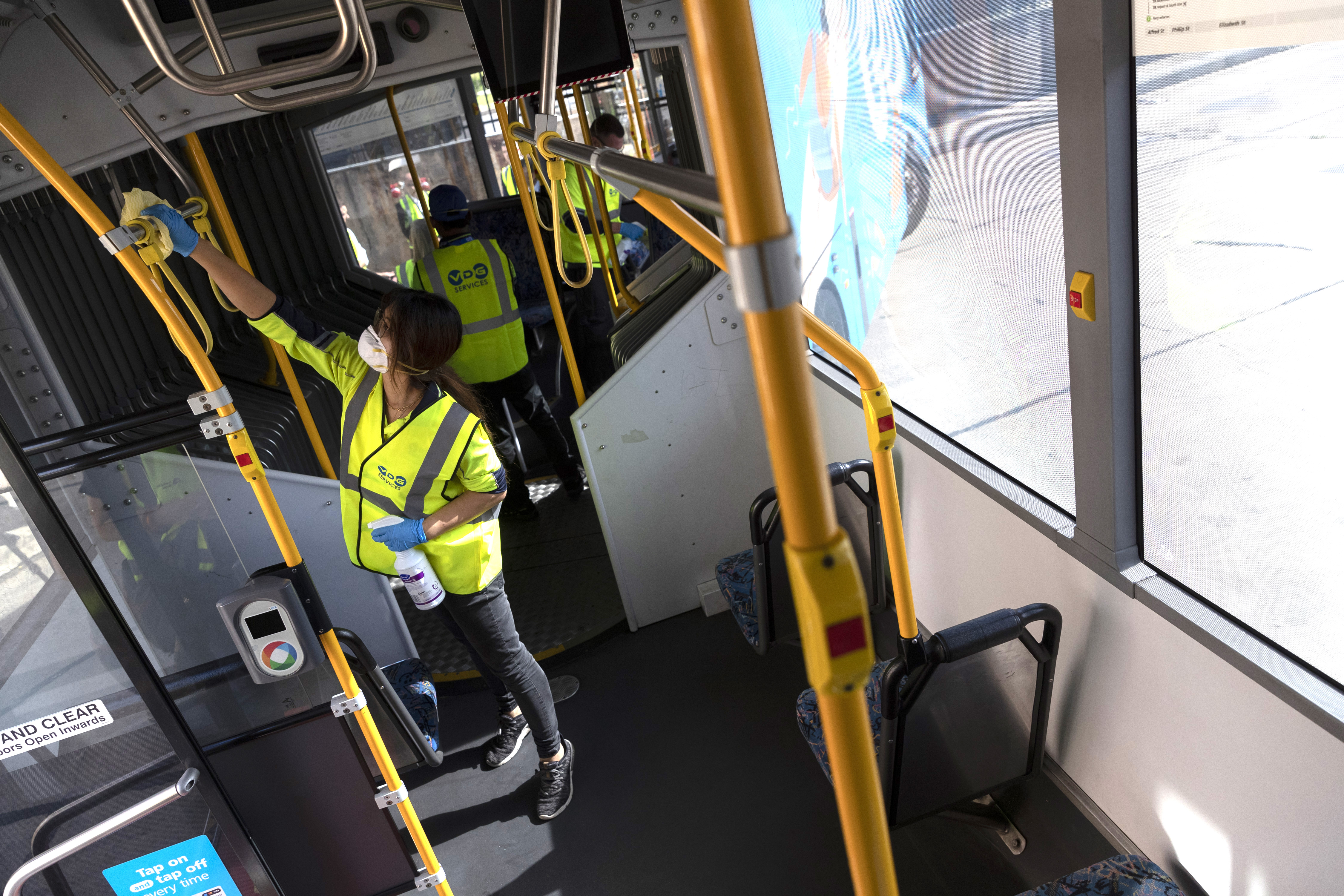 A cleaner at work at the Waverley Bus Depot in Sydney. NSW Treasurer Dominic Perrottet said the equivalent of 3000 full-time cleaners would be working by the end of June in an effort to help combat COVID-19 in New South Wales