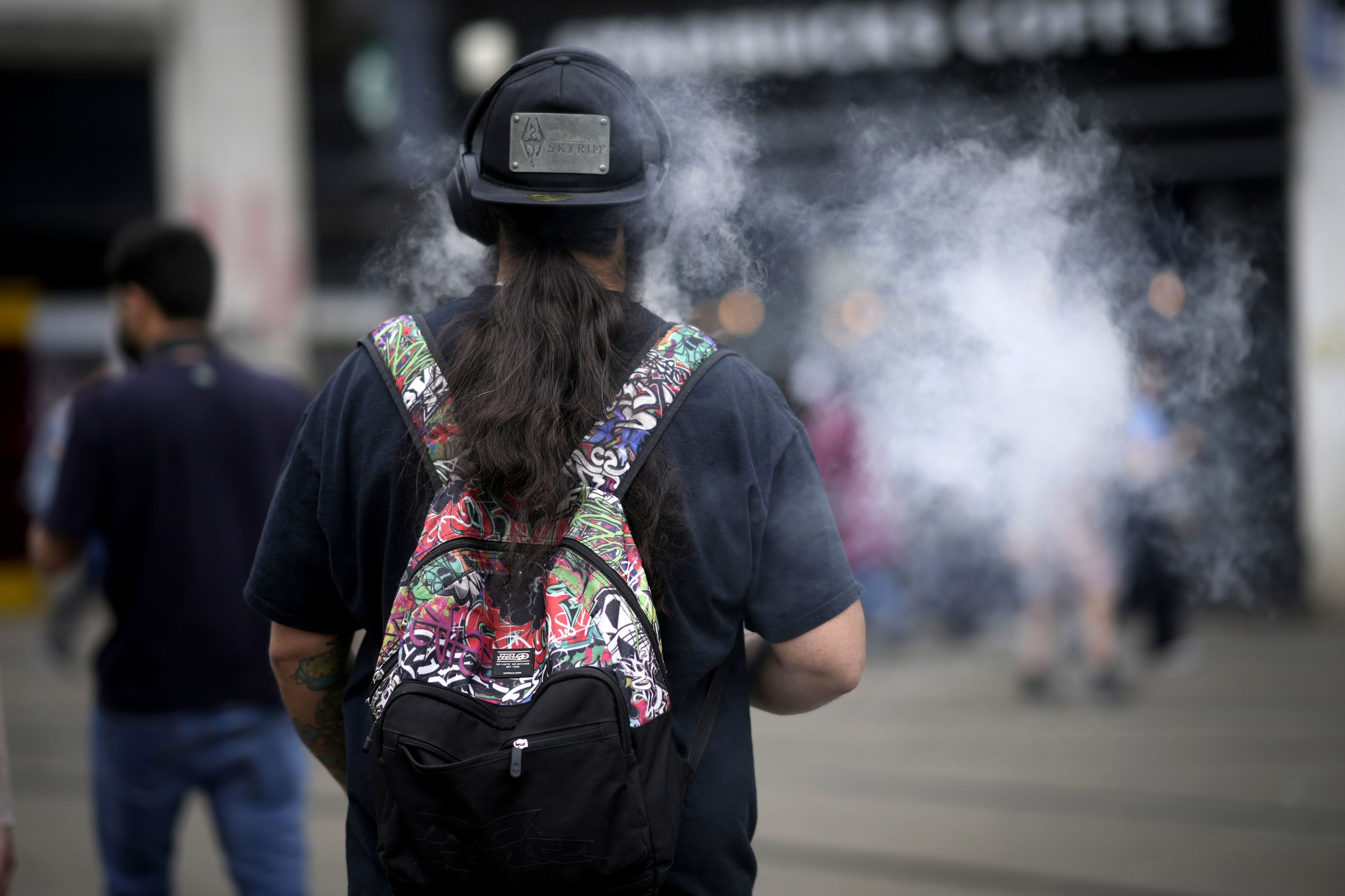 A man smokes a vape