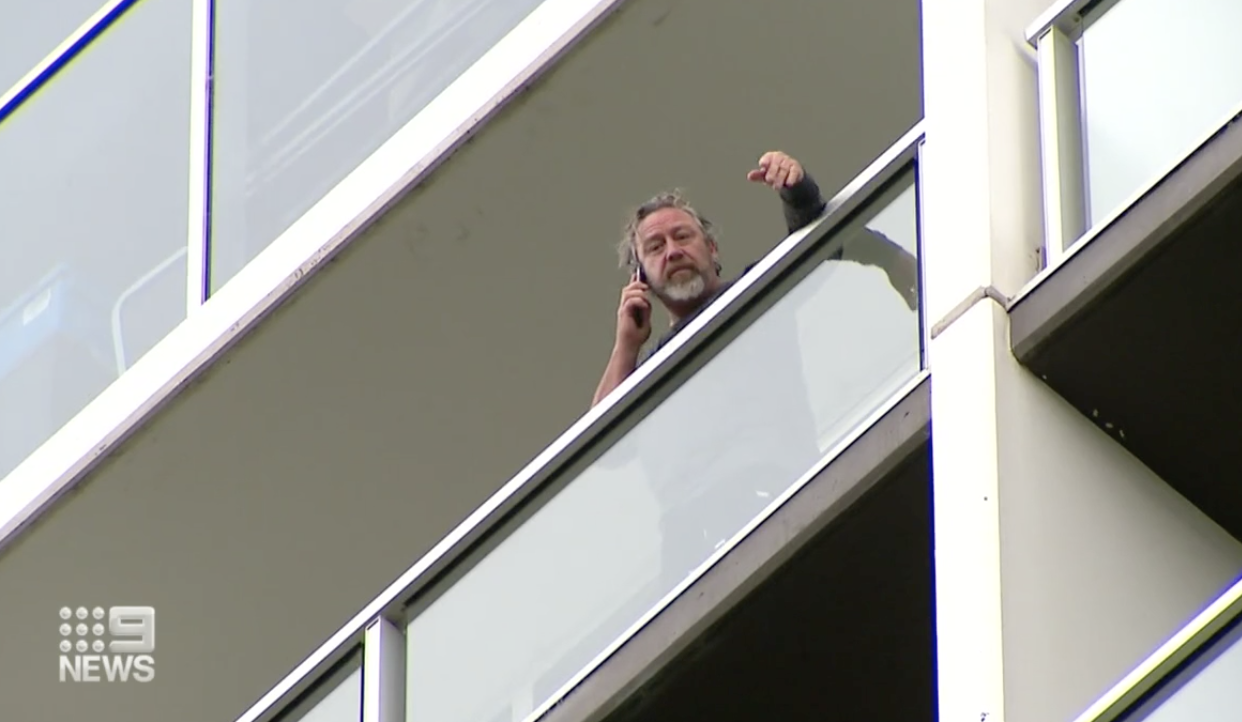 Brad on the balcony of his quarantine hotel.