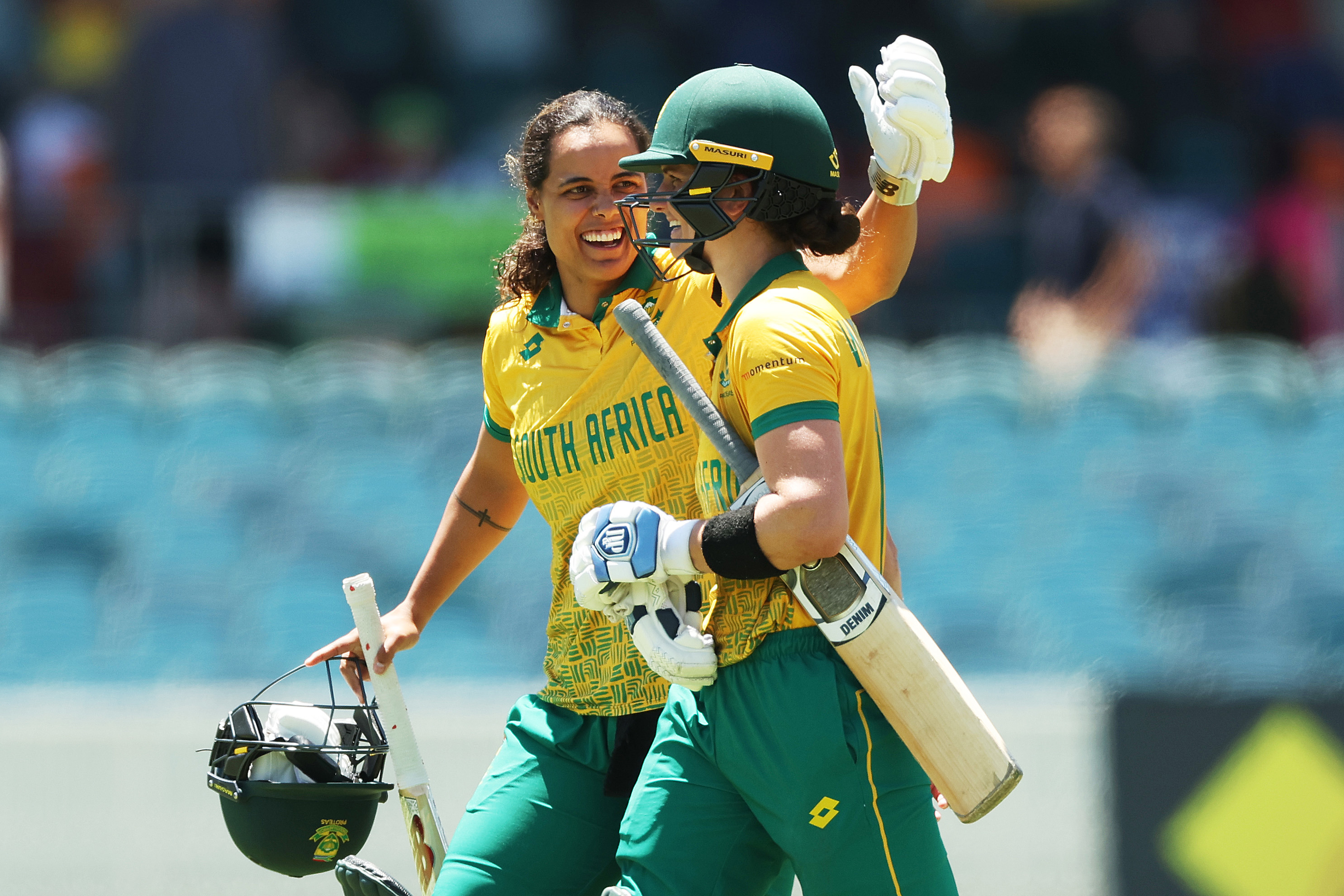Chloe Tryon of and  Laura Wolvaardt of South Africa celebrate victory during game two of the Women's T20 International series between Australia and South Africa at Manuka Oval on January 28, 2024 in Canberra, Australia. (Photo by Mark Metcalfe/Getty Images)