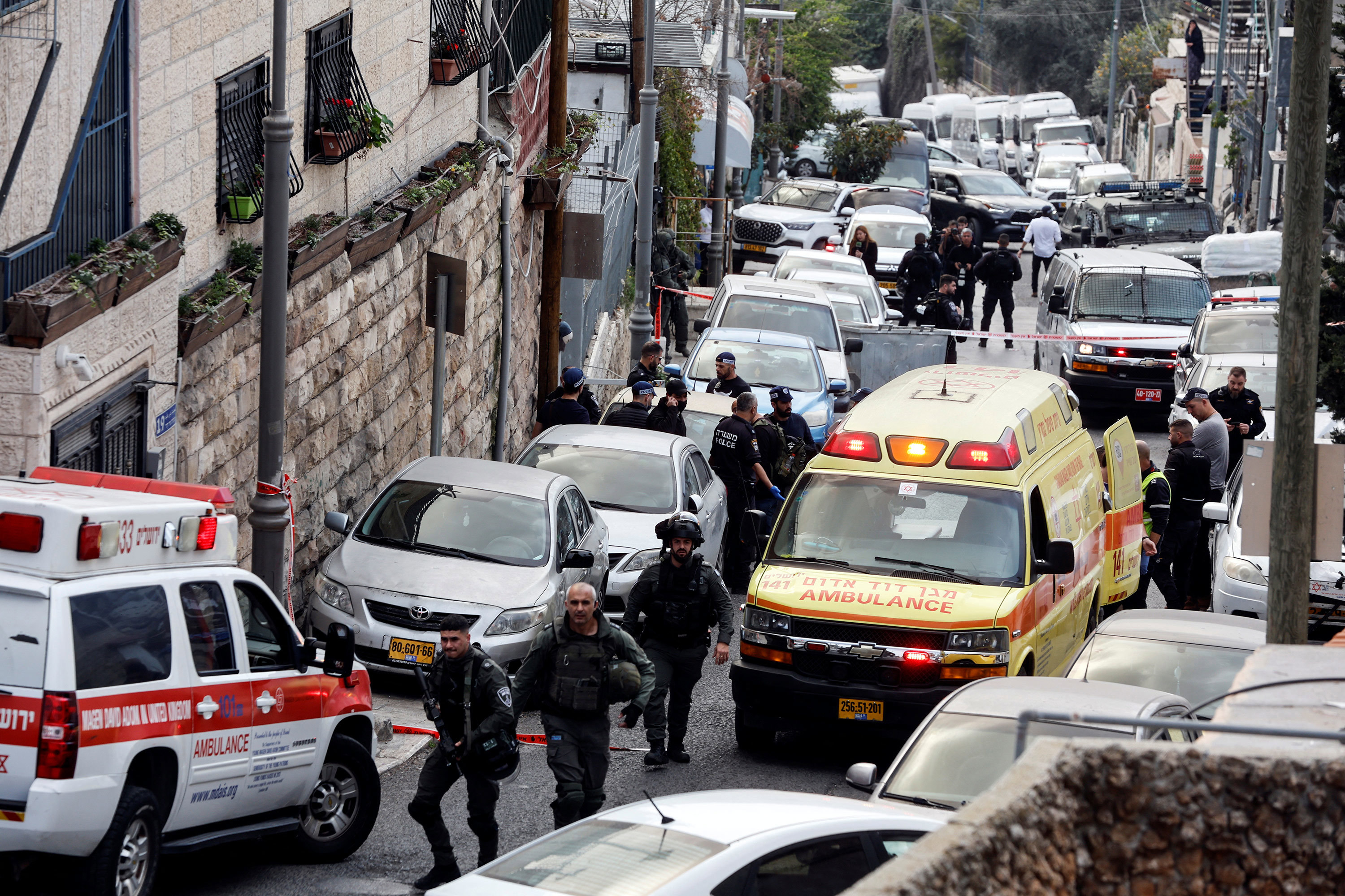 Security and rescue personnel work at a scene where a suspected incident of shooting attack took place, police spokesman said, just outside Jerusalem's Old City January 28, 2023. 