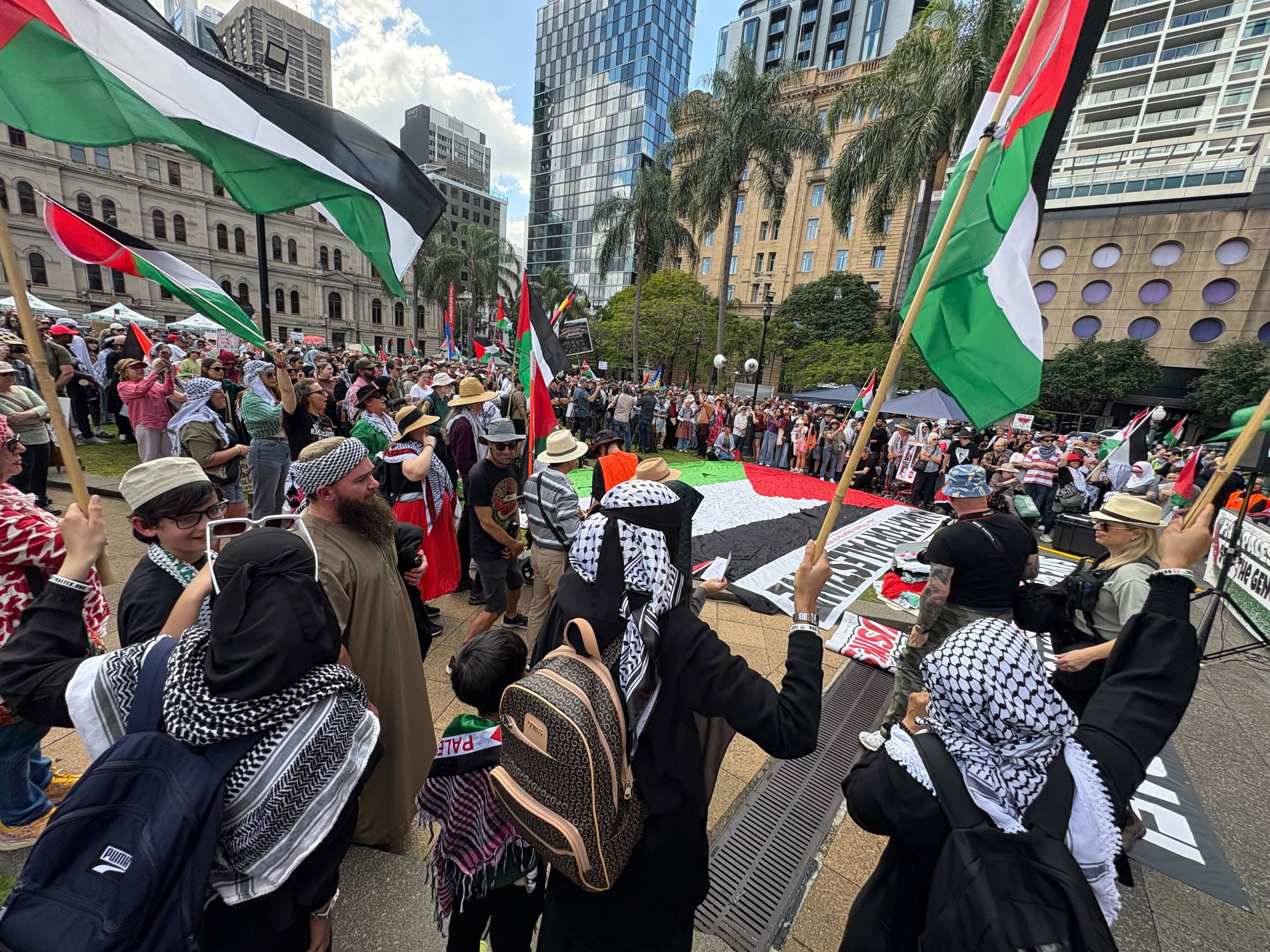 Protesters gather at Queens Gardens in Brisbane. 24/8/2025