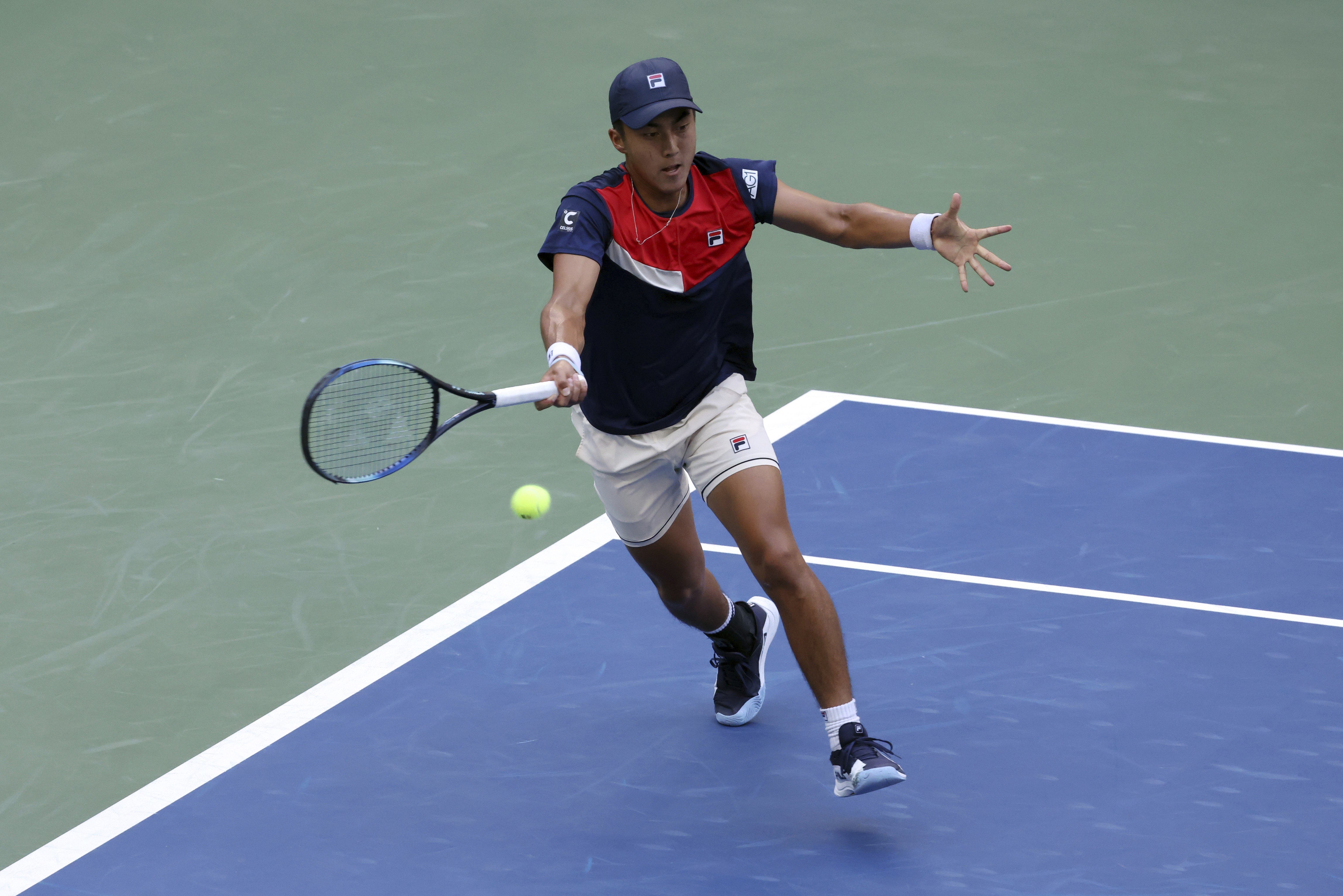 Rinky Hijikata of Australia returns to Frances Tiafoe.