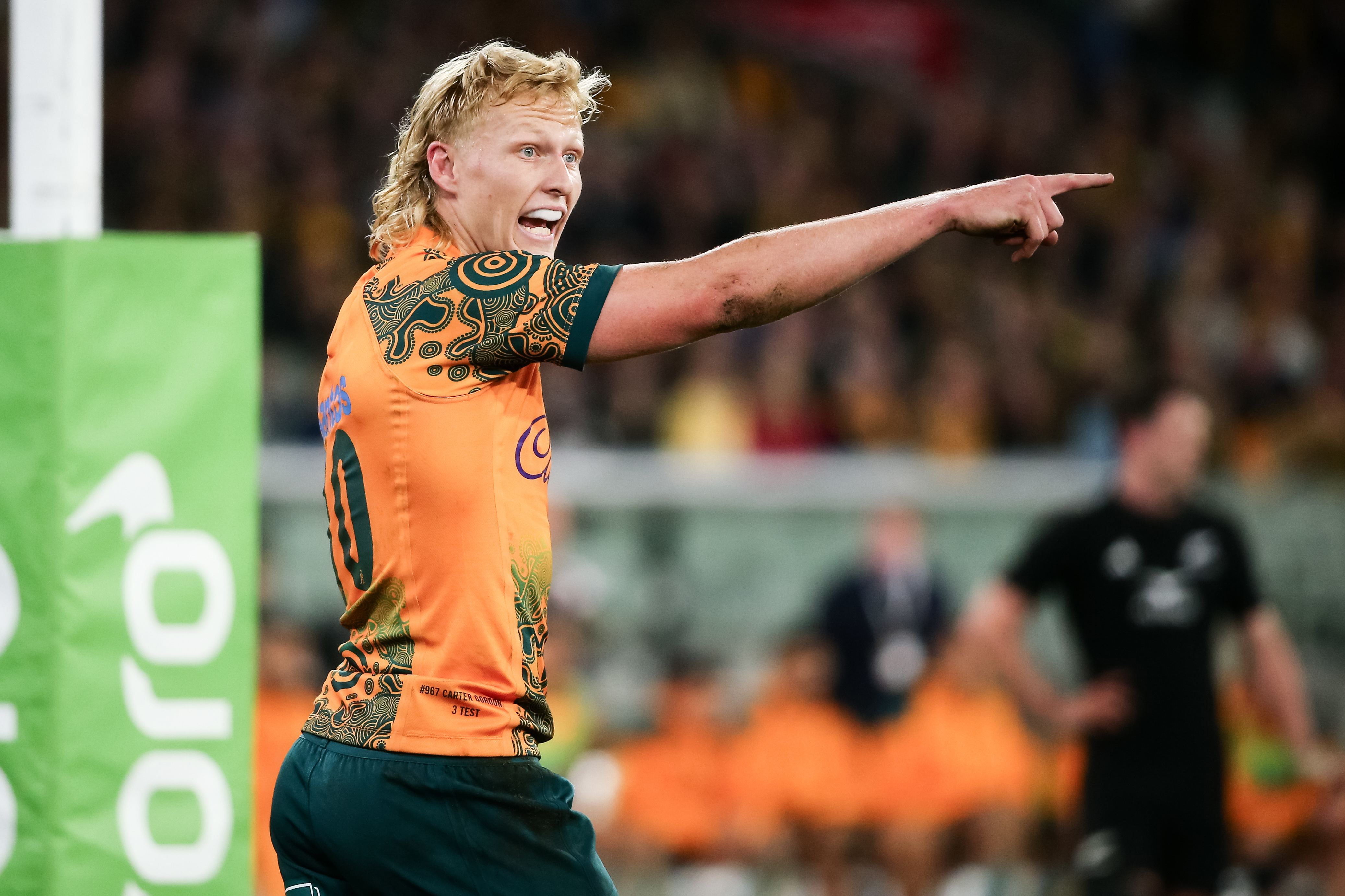 Carter Gordon of the Wallabies gestures to his team.