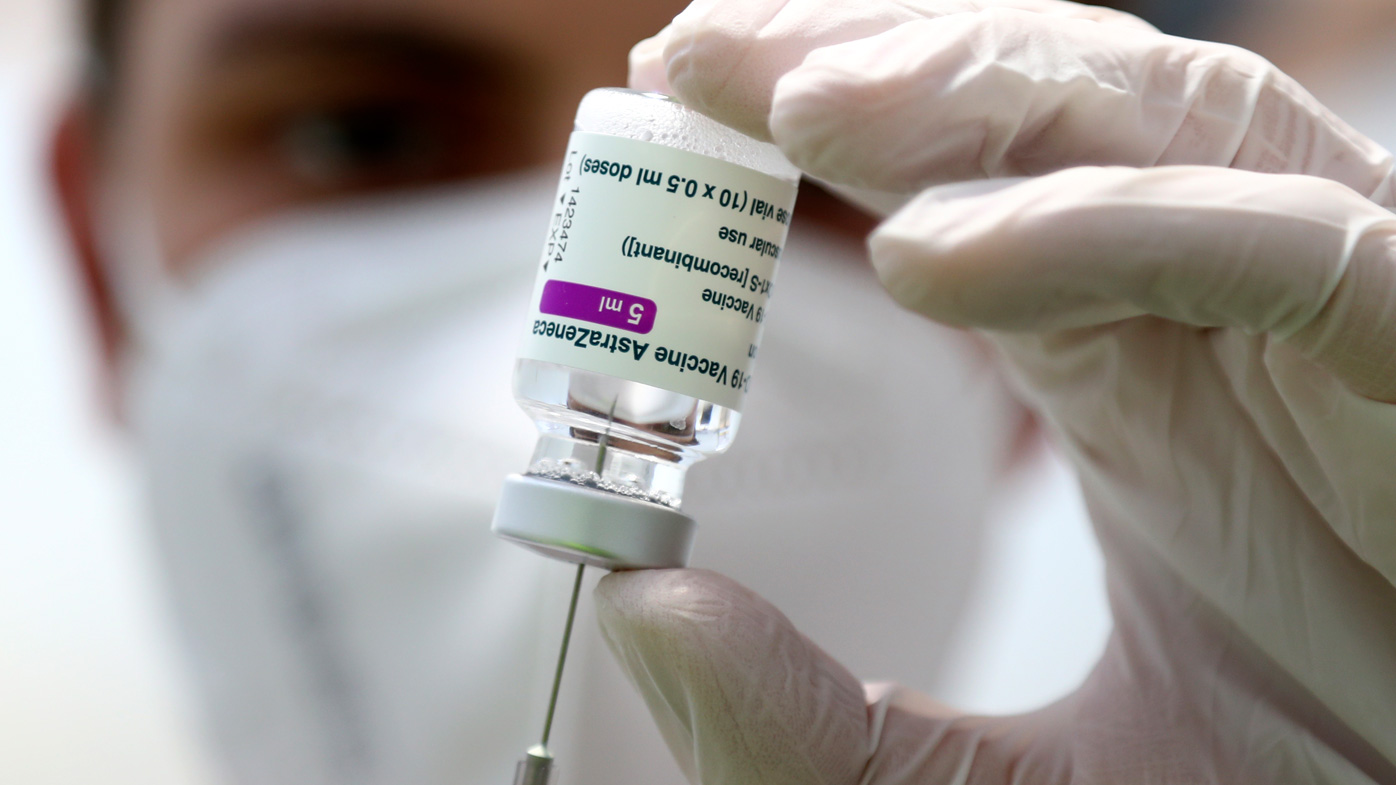 Medical staff prepares a syringe from a vial of the AstraZeneca coronavirus vaccine during preparations at the vaccine center in Ebersberg near Munich, Germany