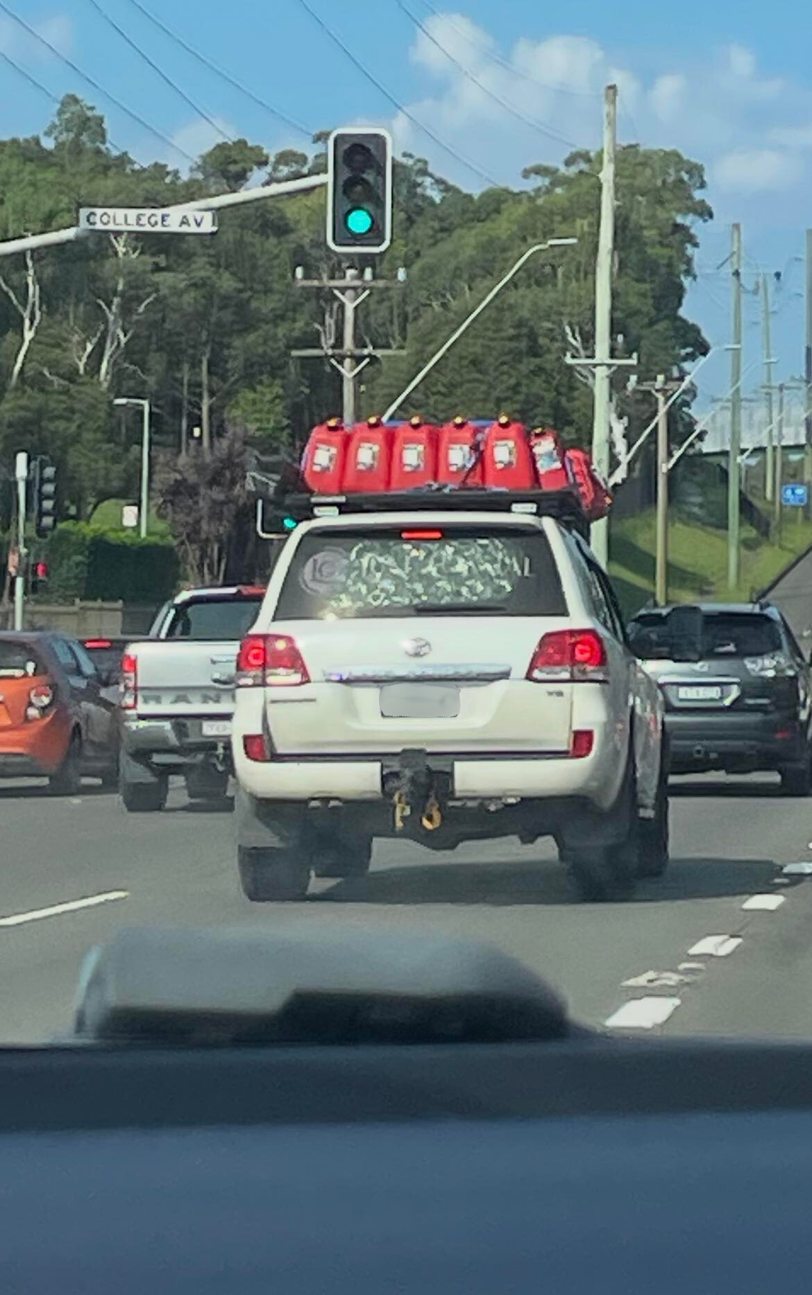 A Toyota was pictured with about 20 jerry cans ﻿attached to the roof in Shellharbour.