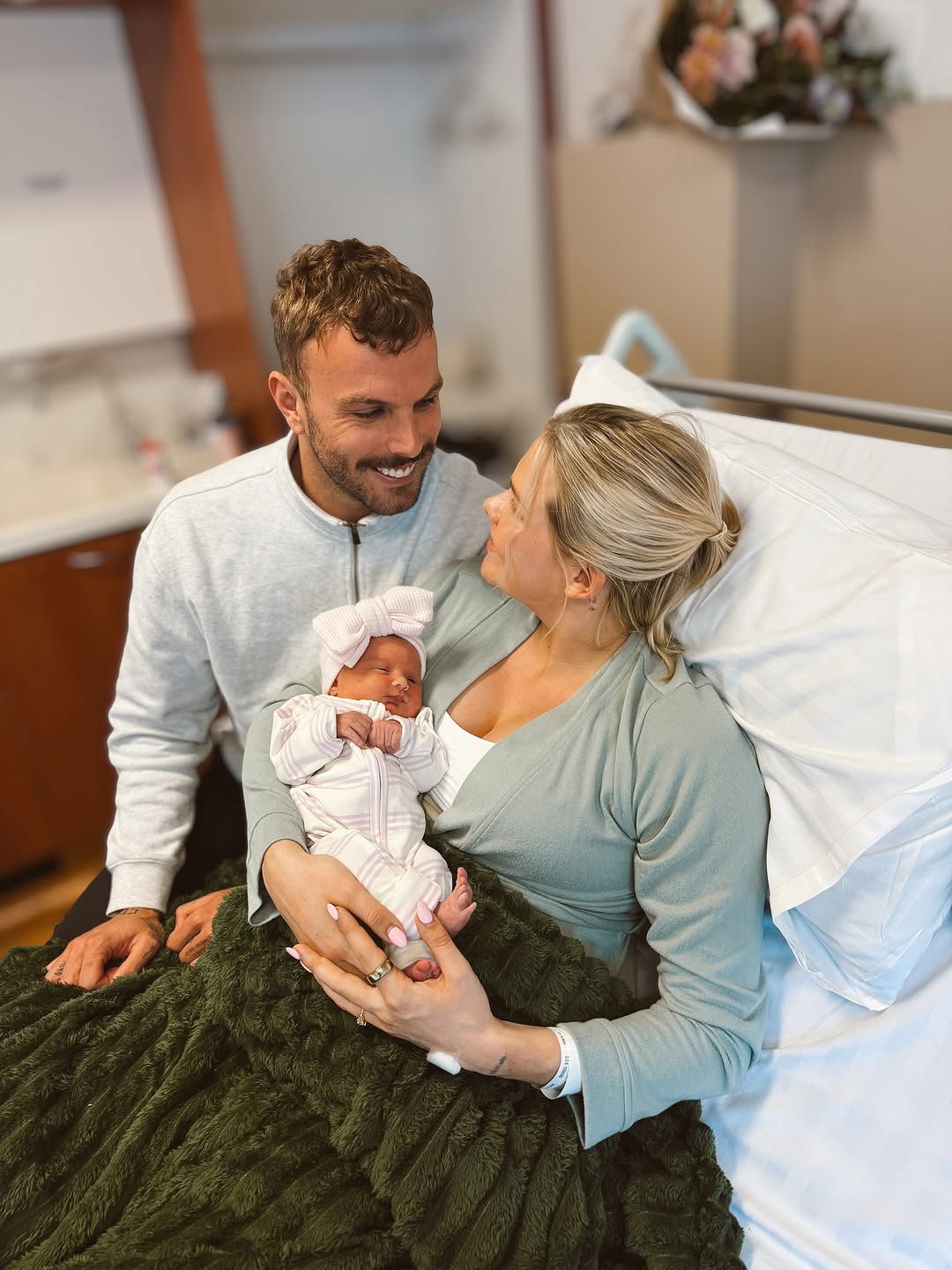 Kyle Chalmers and ﻿Ingeborg Løyning with their baby daughter Astrid, August 2025