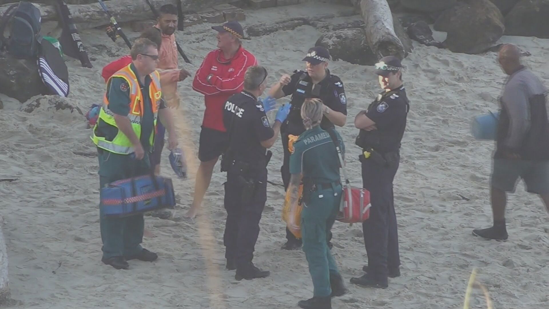Emergency services at Froggies Beach in Coolangatta on Sunday afternoon.