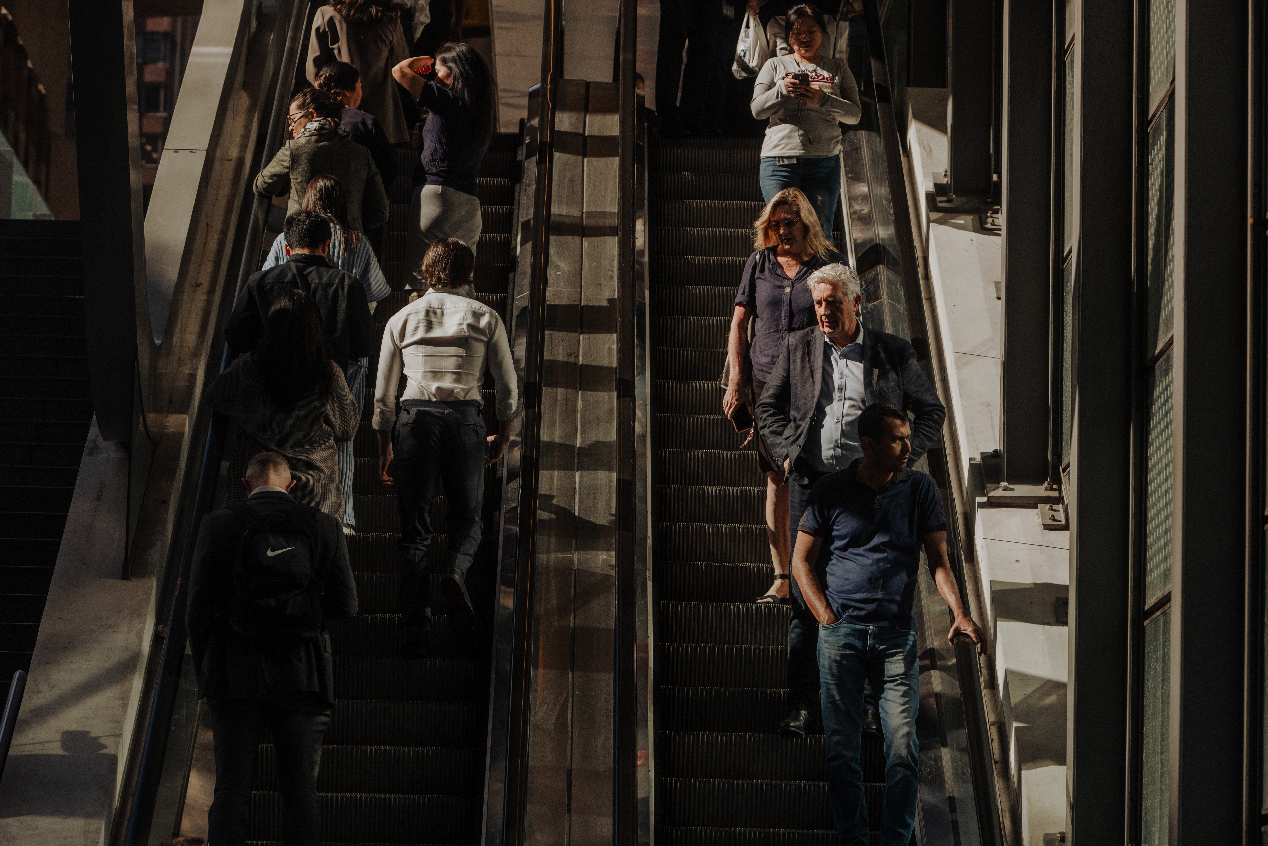 Pedestrians and office workers walk through the Sydney CBD. 