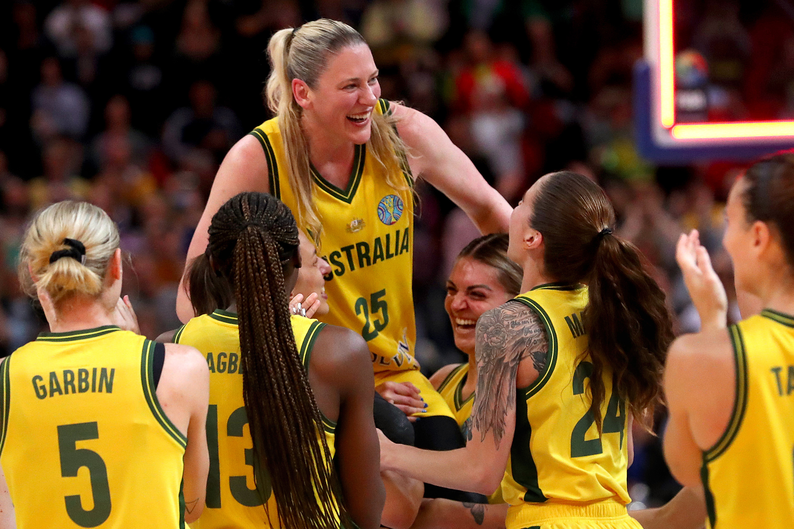 Lauren Jackson celebrates with teammates after playing her final game for the Opals.