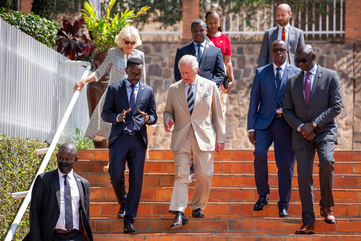 Prince Charles, center, and Camilla, Duchess of Cornwall, above-left, arrive to visit the Kigali Genocide Memorial in the capital Kigali, Rwanda Wednesday, June 22, 2022.