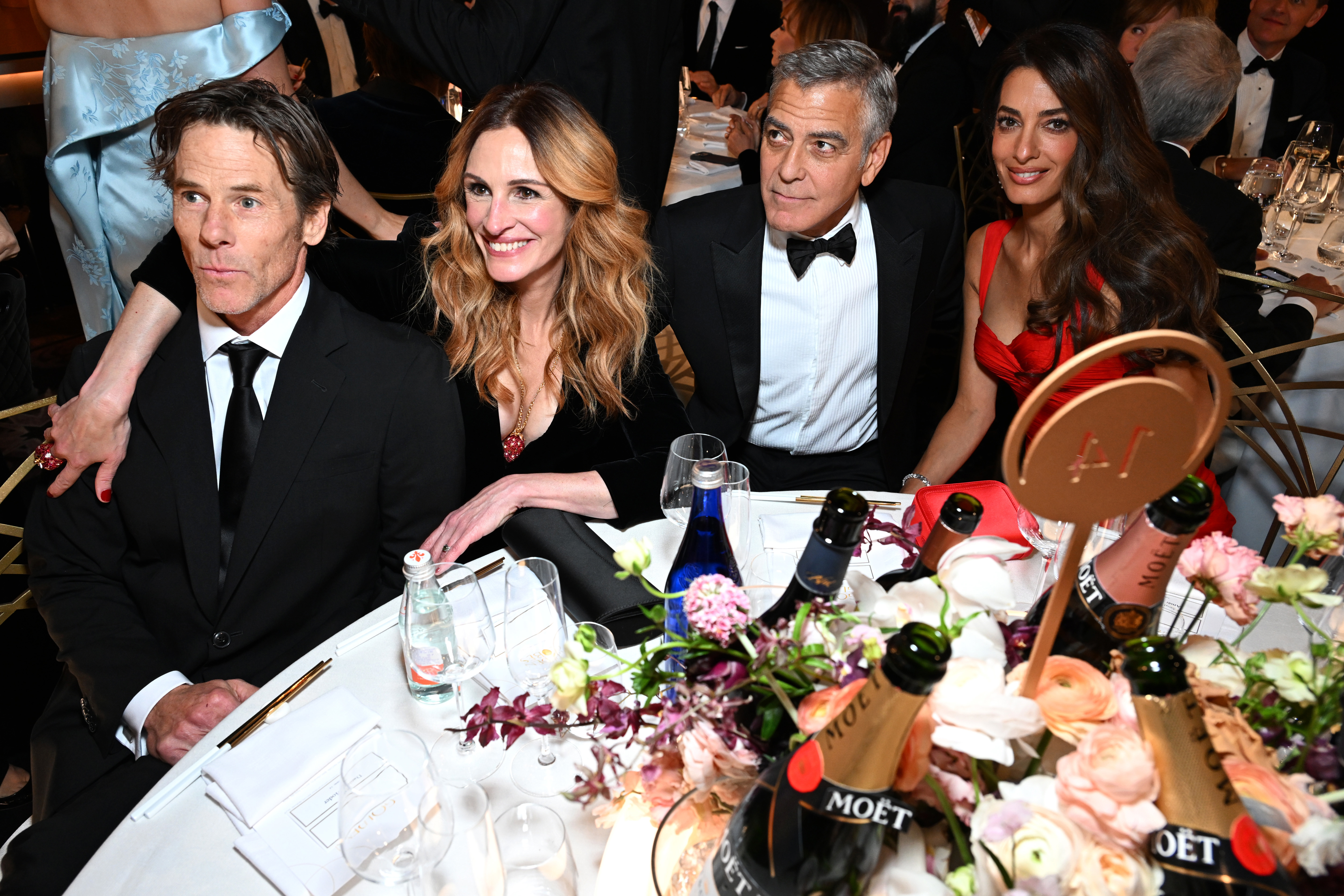 LOS ANGELES, CALIFORNIA - JANUARY 11: (L-R) Daniel Moder, Julia Roberts, George Clooney and Amal Clooney attend Moët & Chandon At The 83rd Annual Golden Globe Awards on January 11, 2026 in Los Angeles, California.  (Photo by Michael Kovac/Getty Images for Moët & Chandon)