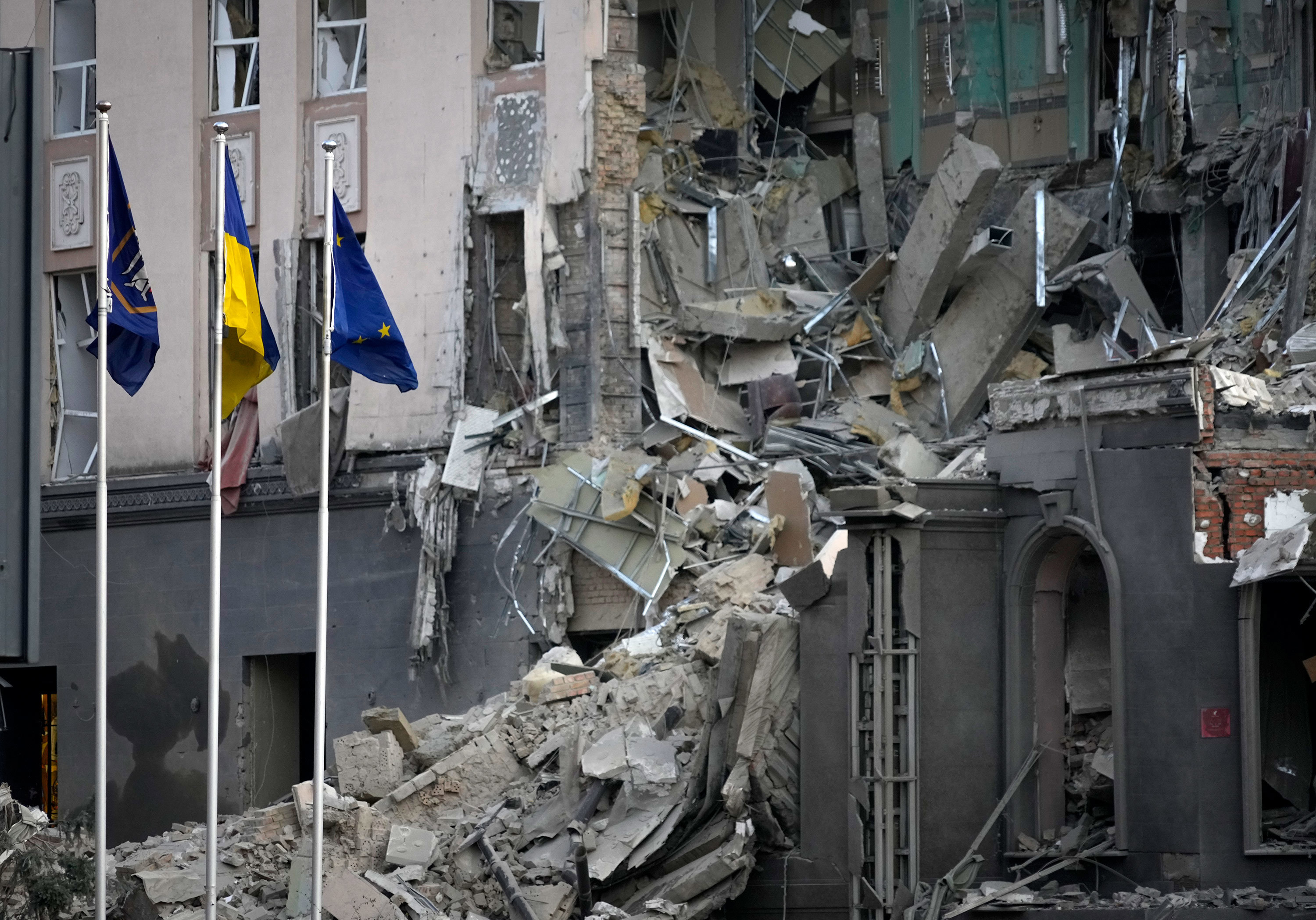 A damaged hotel at the scene of Russian shelling in Kyiv, Ukraine, Saturday, Dec. 31, 2022.