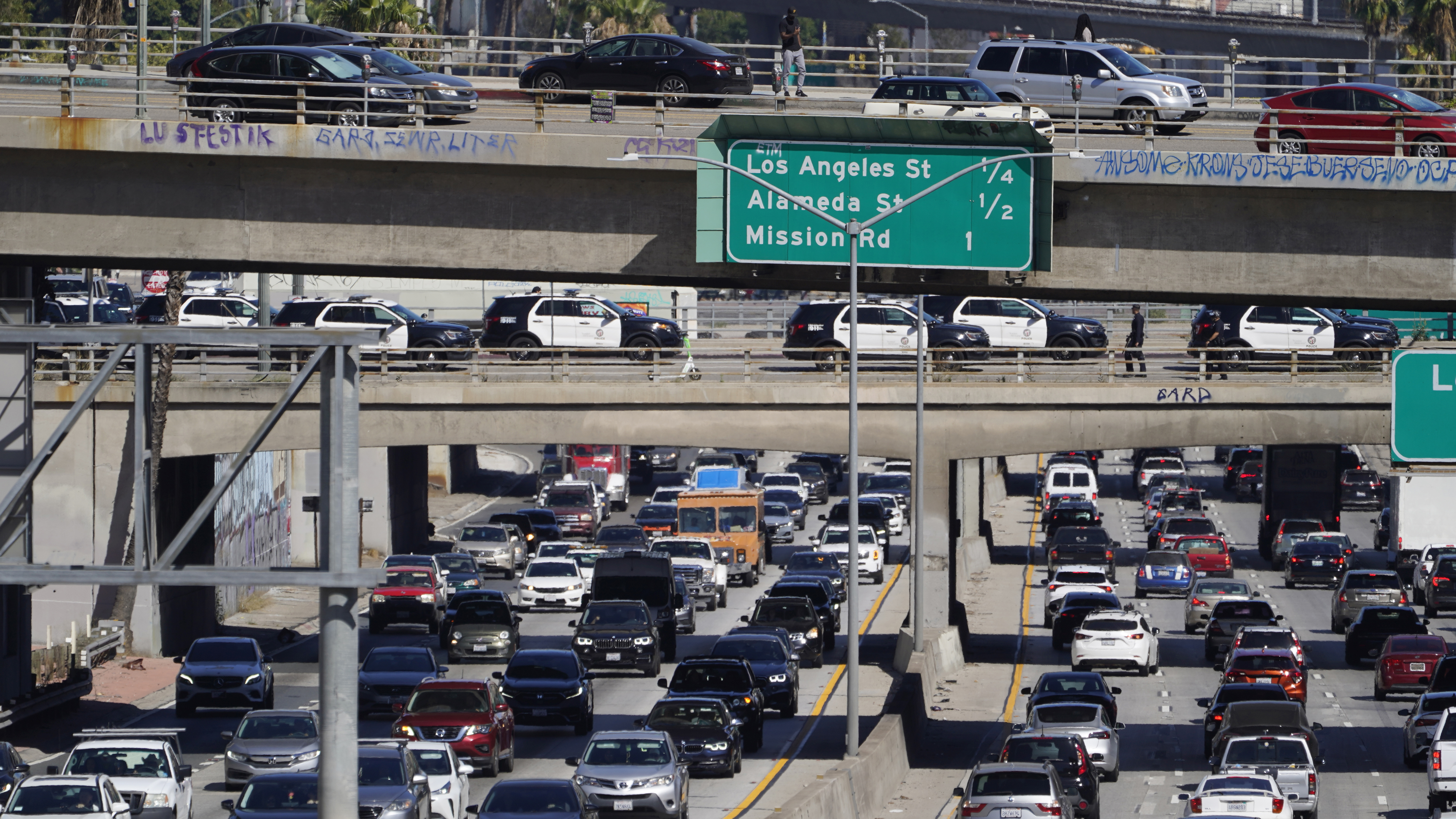 Motorists stand still as supporters of abortion rights briefly blocked traffic on the Hollywood Freeway U.S. 101 in downtown Los Angeles.