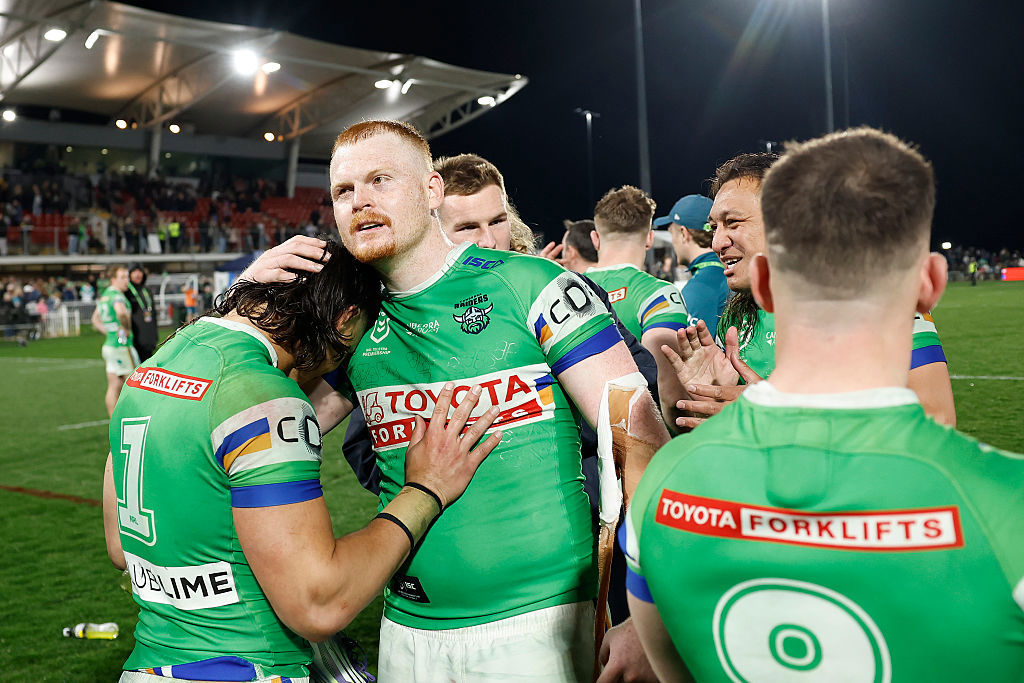 Corey Horsburgh of the Raiders embraces teammate Kaeo Weekes.