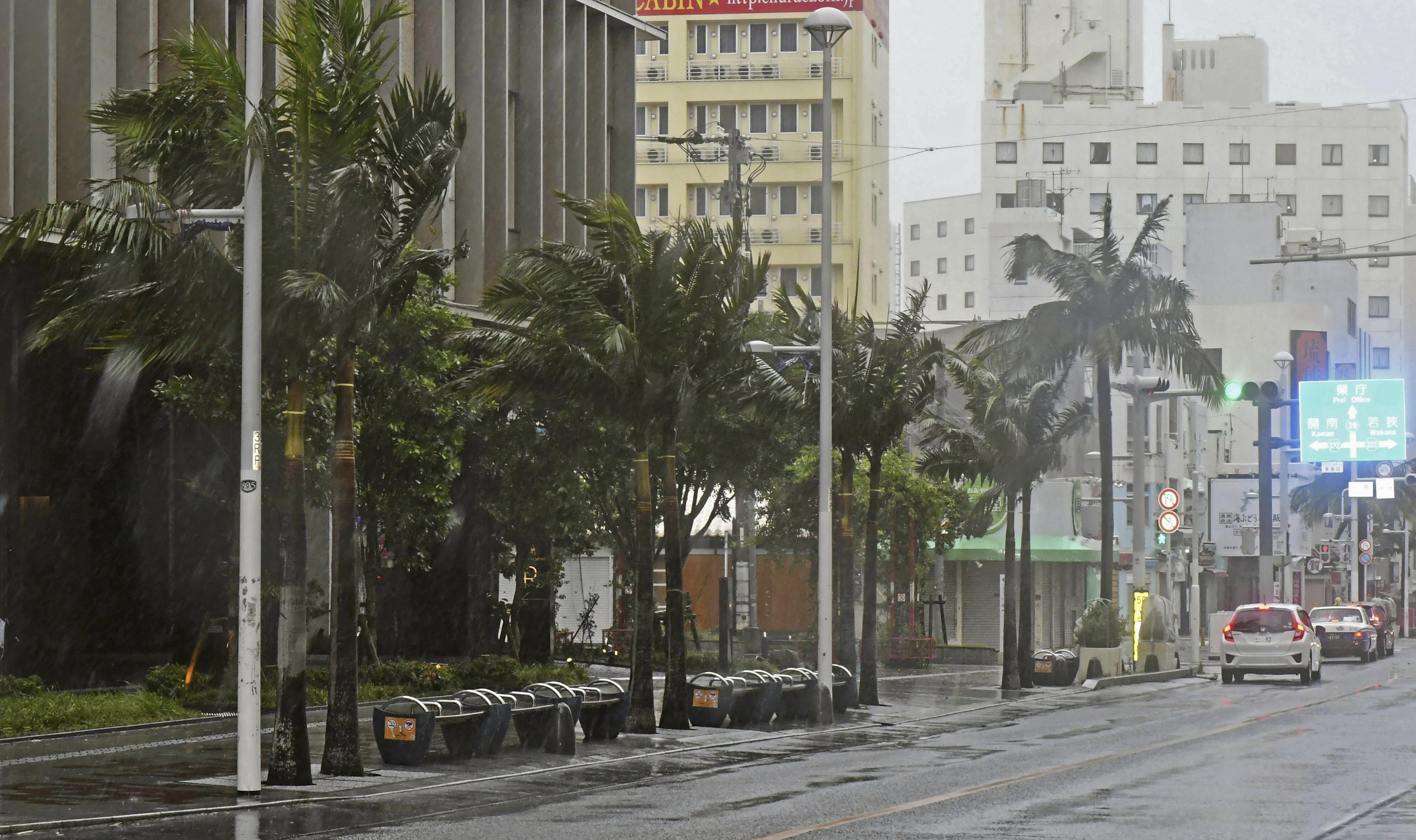 A main street is deserted as Typhoon Khanun approaches Naha city, Okinawa prefecture, southern Japan, Saturday, August 5, 2023.