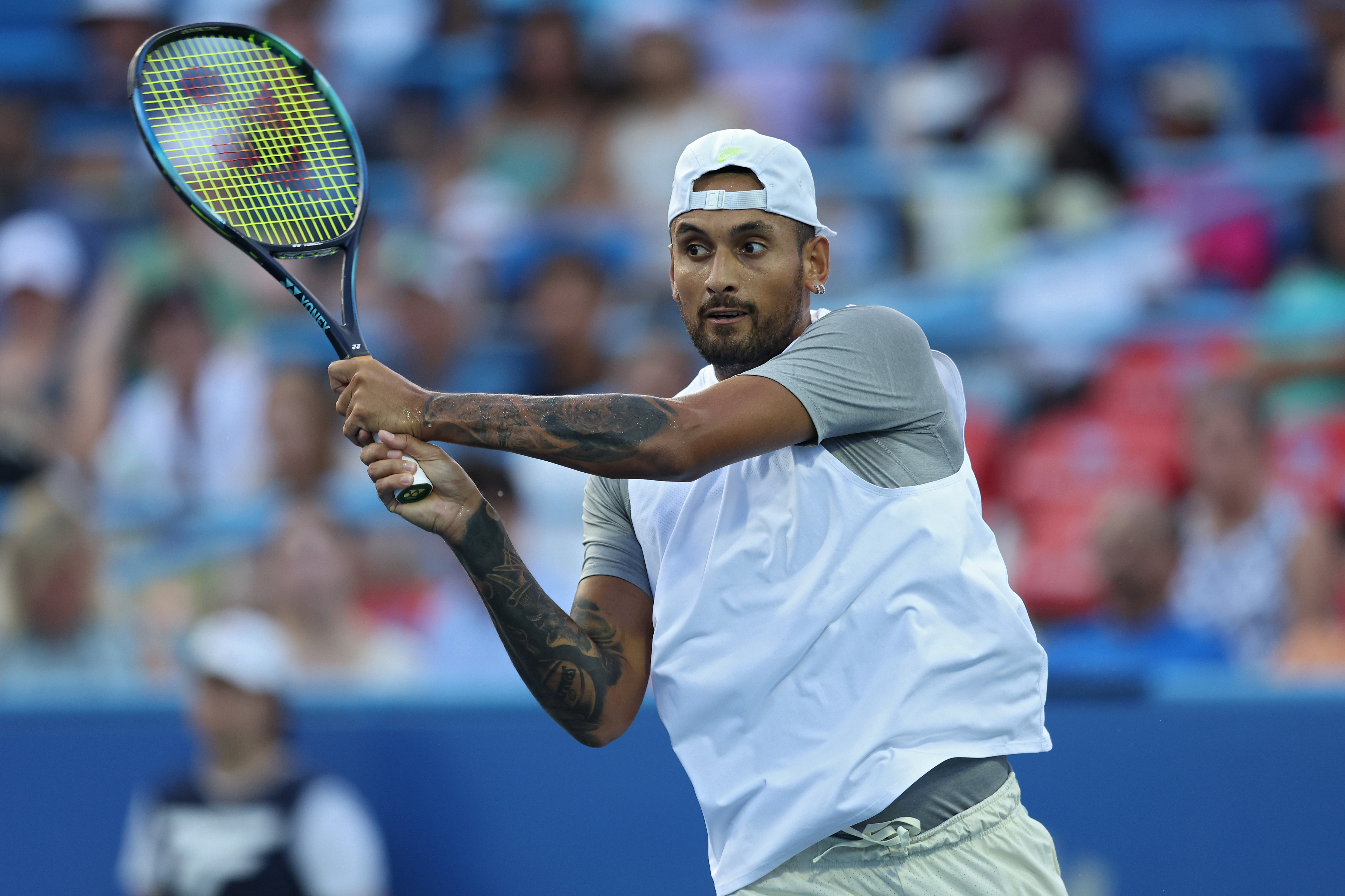 Nick Kyrgios of Australia returns a shot to Mikael Ymer of Sweden in the Men's Semifinal during Day 8 of the Citi Open at Rock Creek Tennis Center on August 6, 2022 in Washington, DC. (Photo by Patrick Smith/Getty Images)