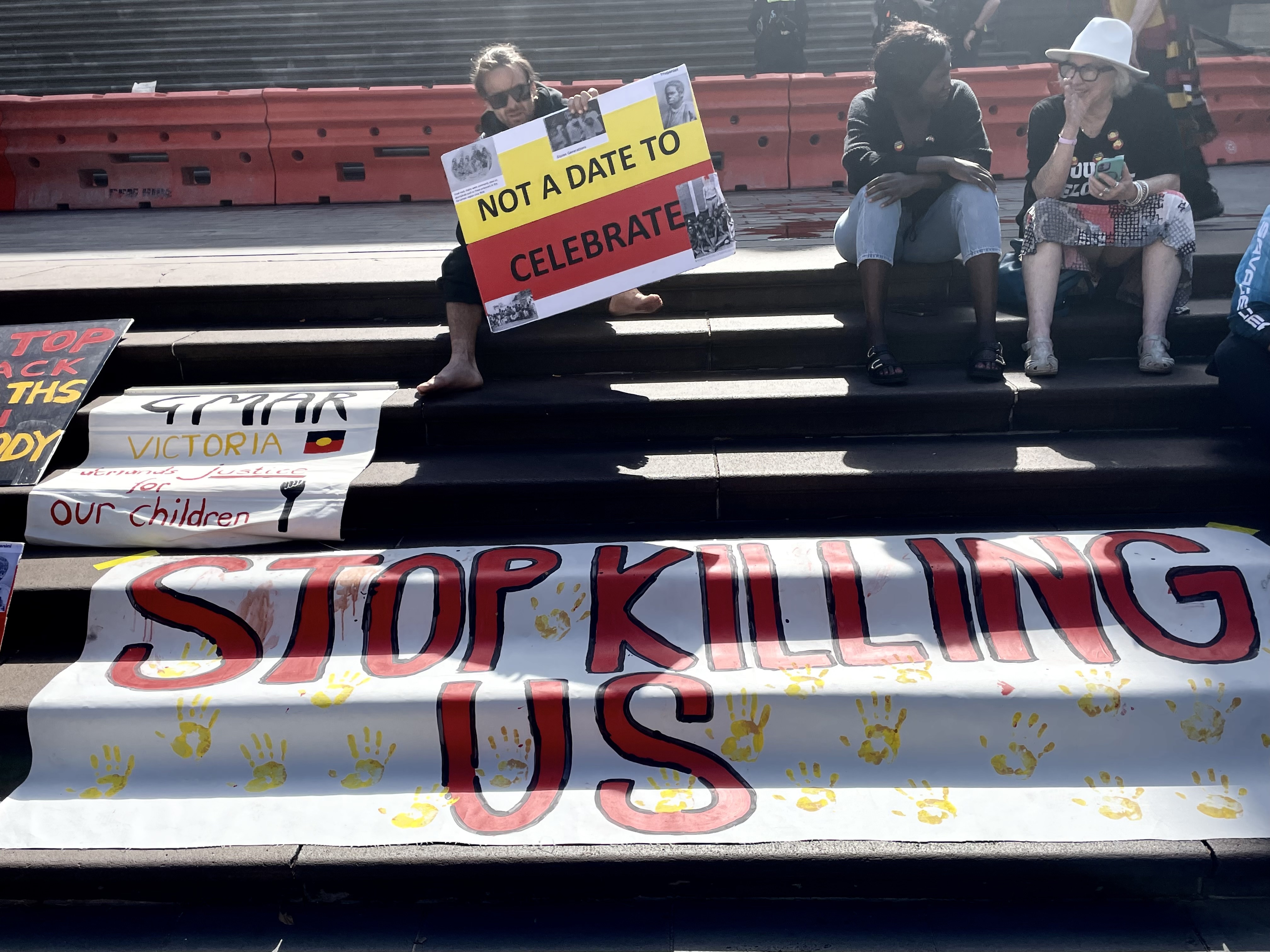 IMG_2177.jpegA man prepares for the Invasion Day rally on Australia Day in the Melbourne CBD