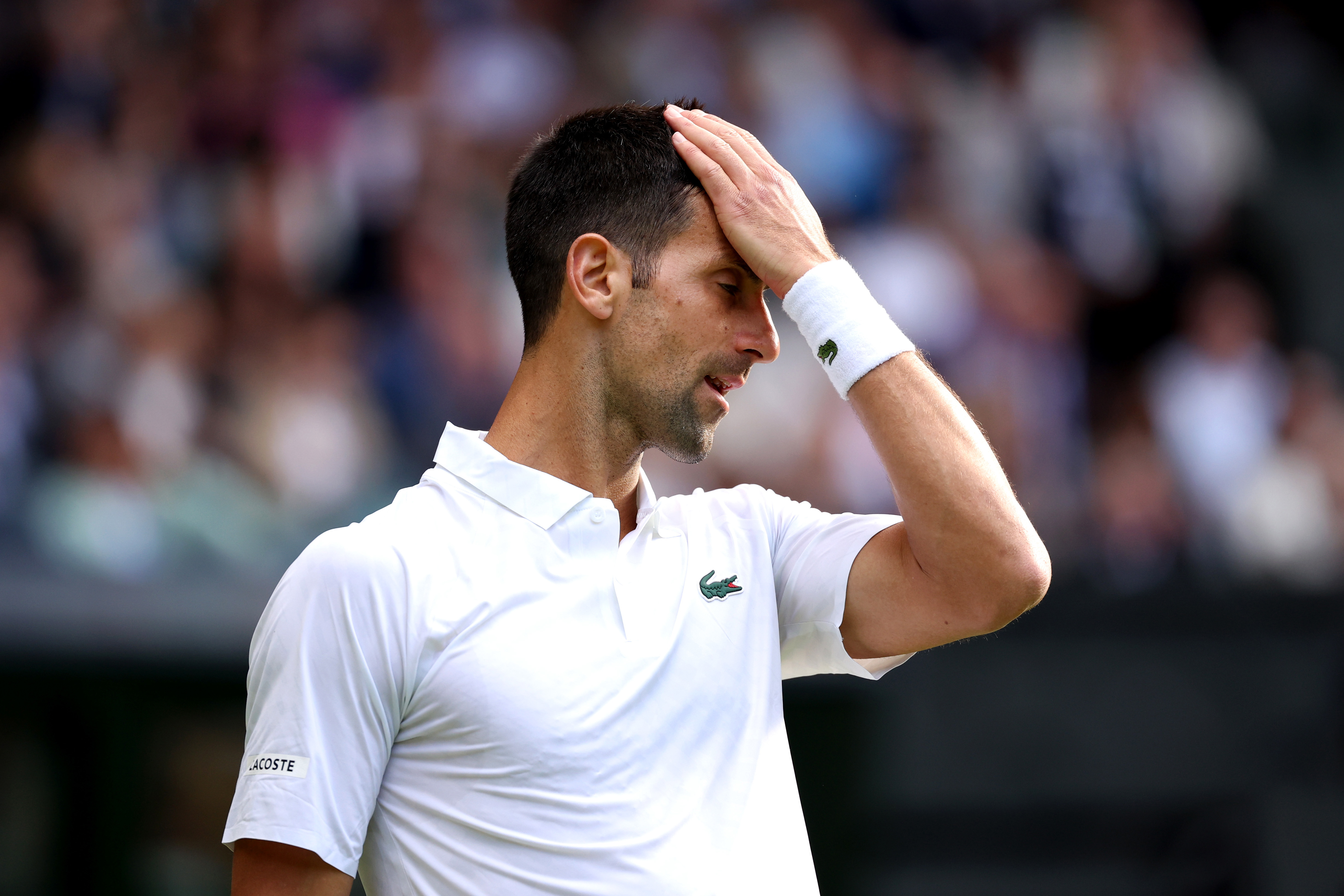 Novak Djokovic of Serbia reacts against Jordan Thompson of Australia.