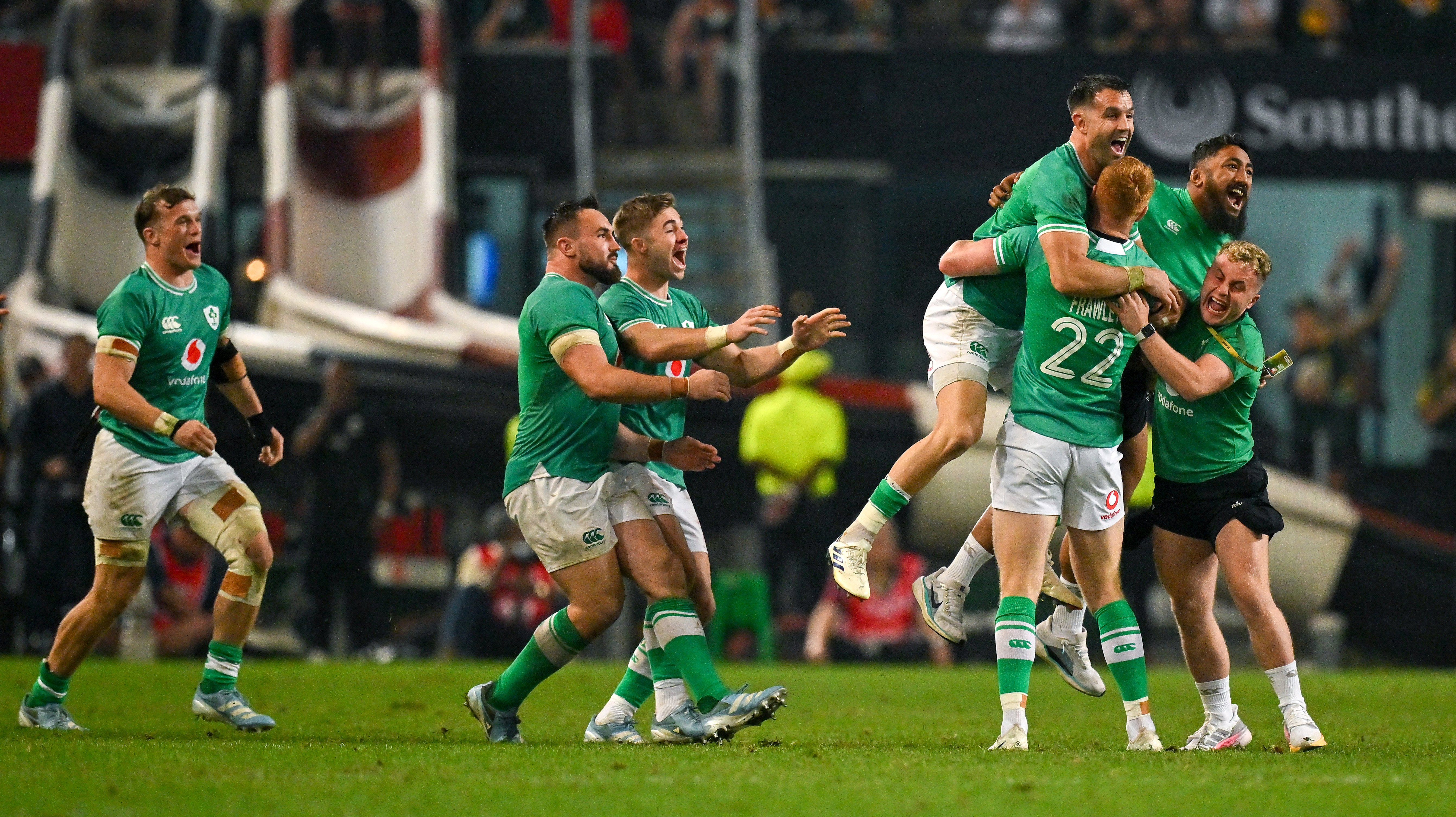 Ciaran Frawley of Ireland celebrates with teammates after kicking the winning drop goal.