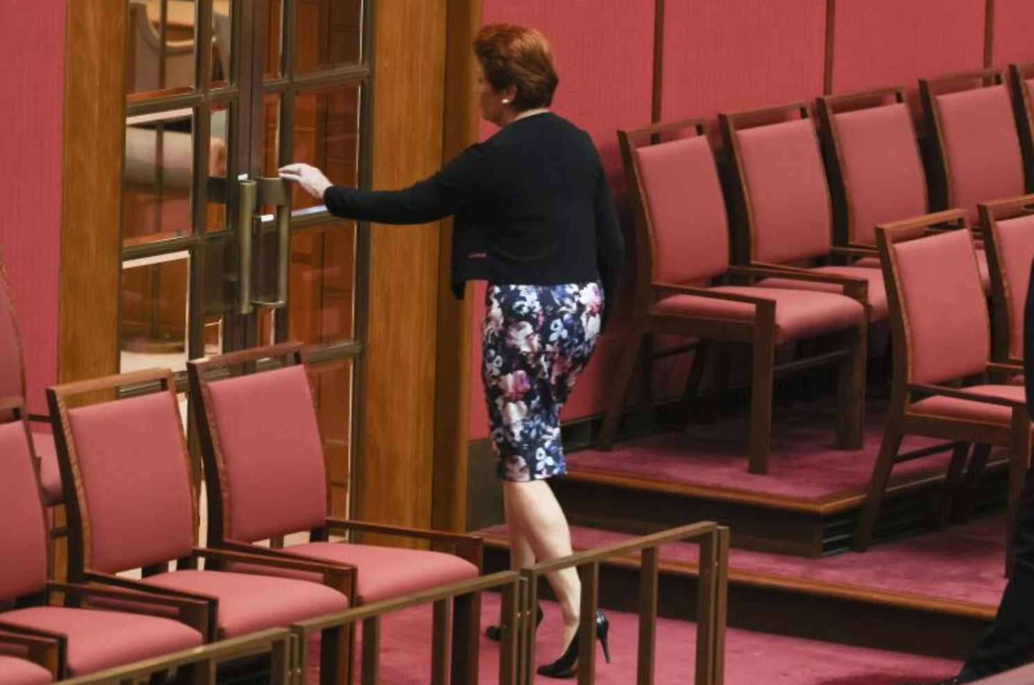 One Nation leader Senator Pauline Hanson exits the Senate